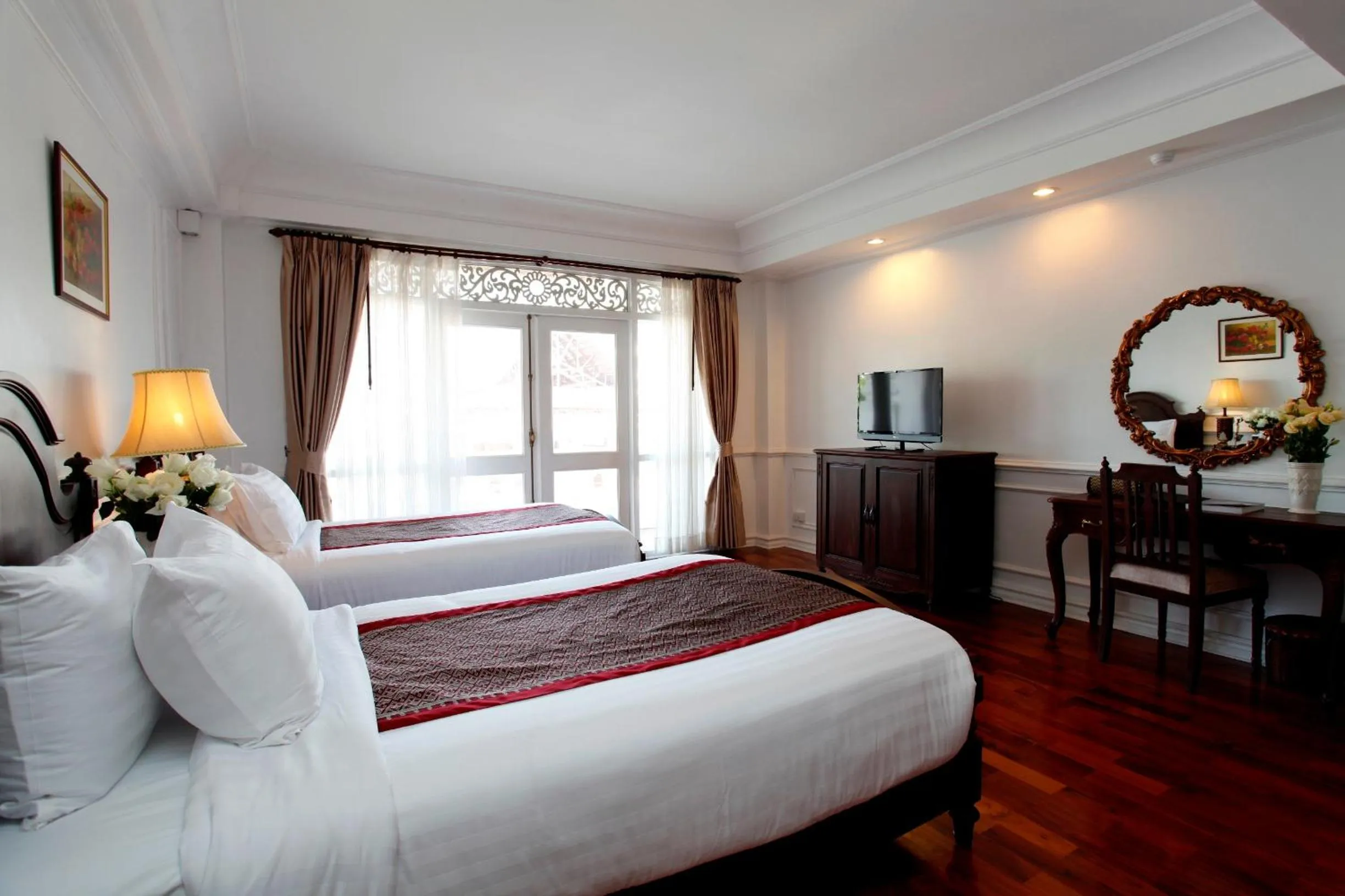 Bed in Dhavara Boutique Hotel