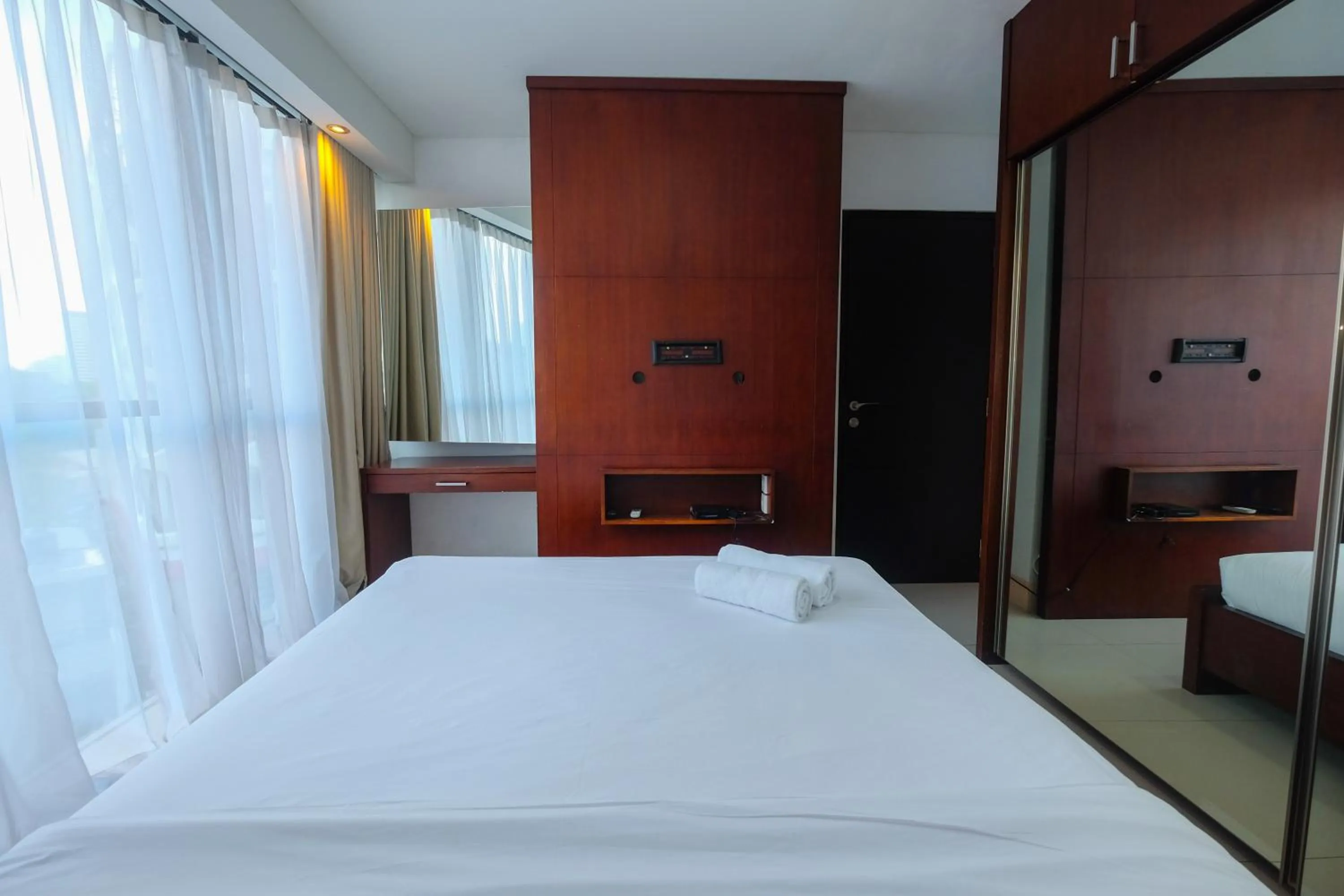 Bed in Best and Homey 2BR Taman Sari Semanggi Apartment By Travelio