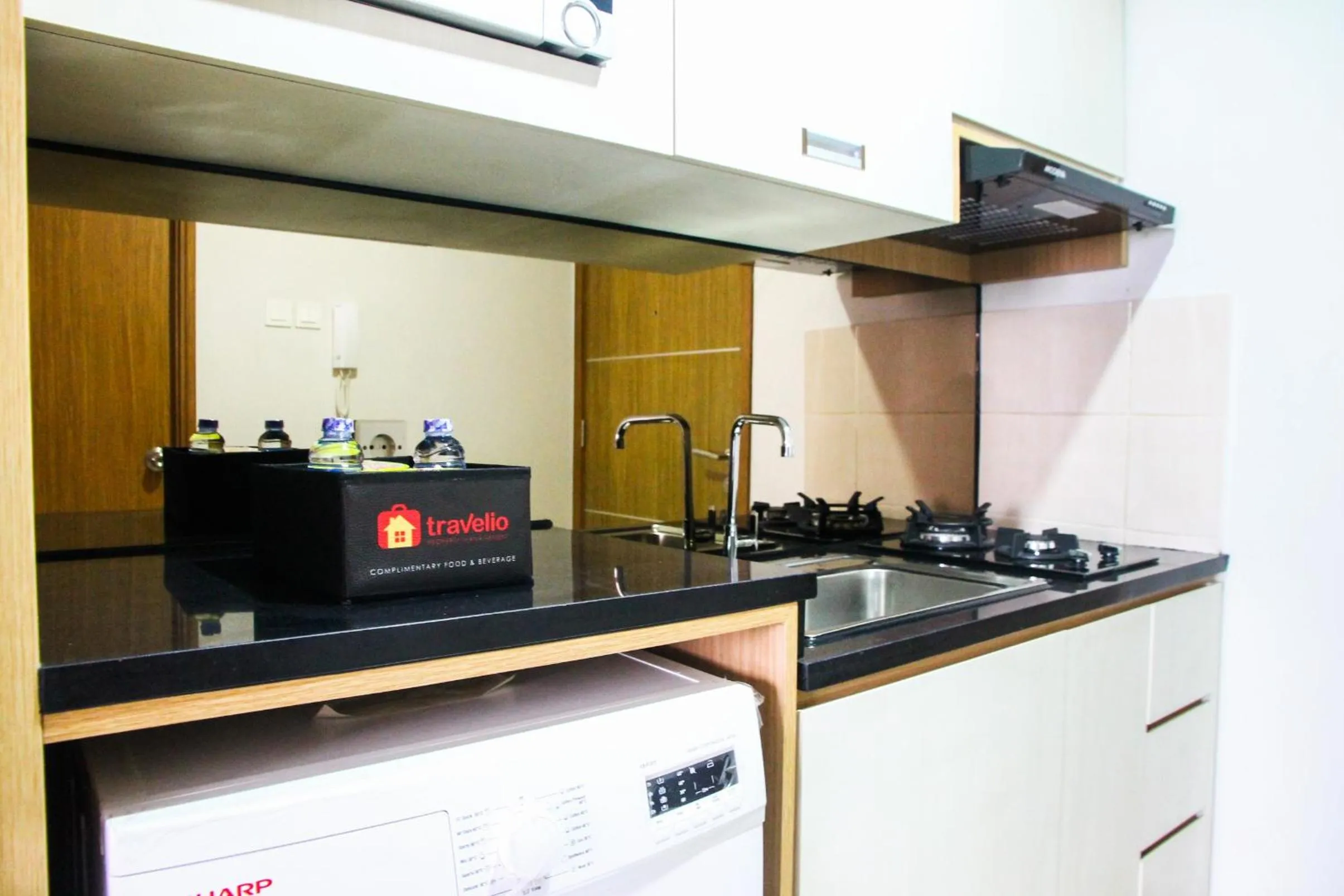 Kitchen or kitchenette in Best and Homey 2BR Taman Sari Semanggi Apartment By Travelio