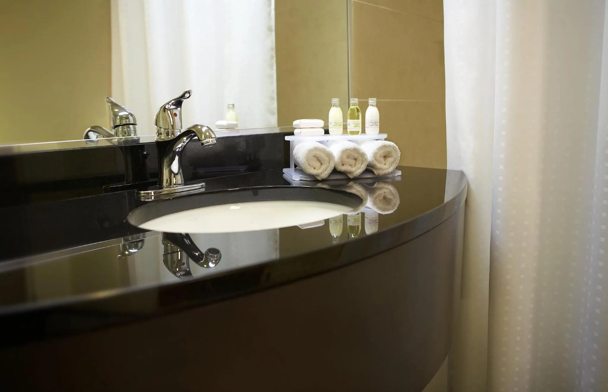 Bathroom in Holiday Inn & Suites Montreal Airport by IHG
