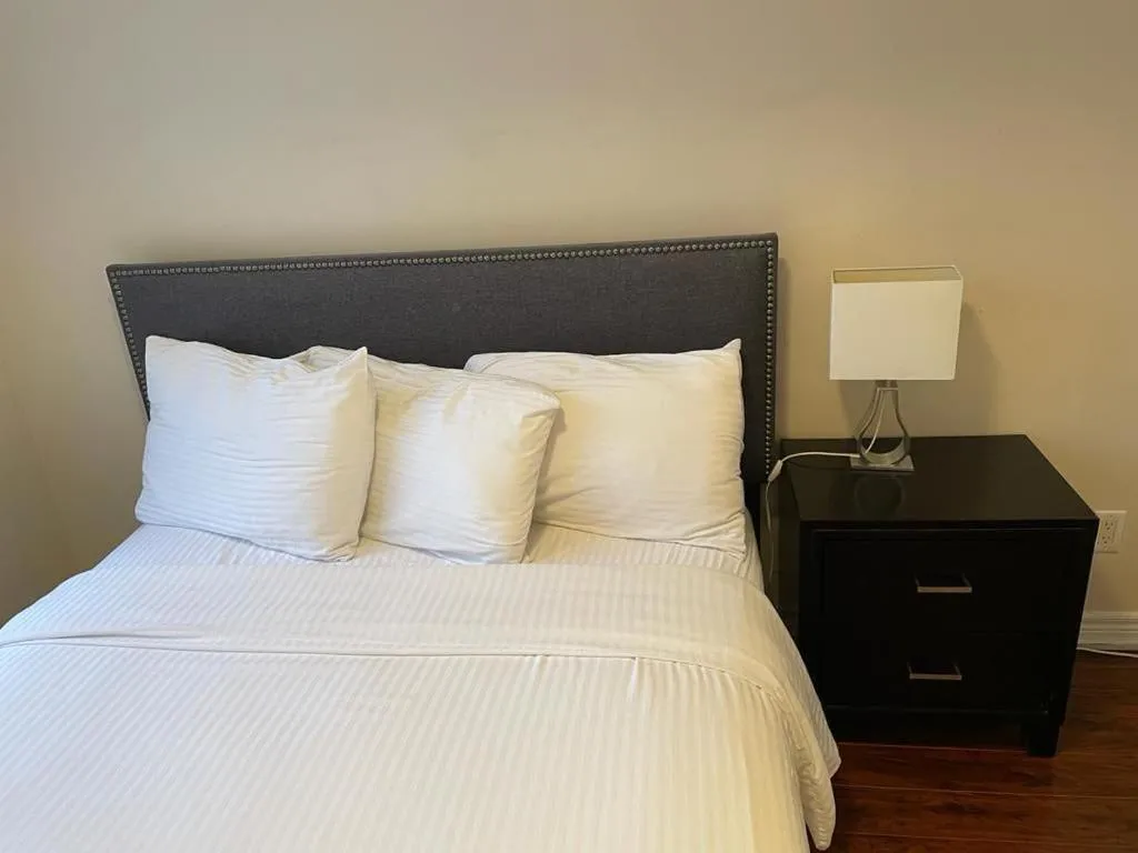 Bed in Platinum Suites Furnished Executive Suites