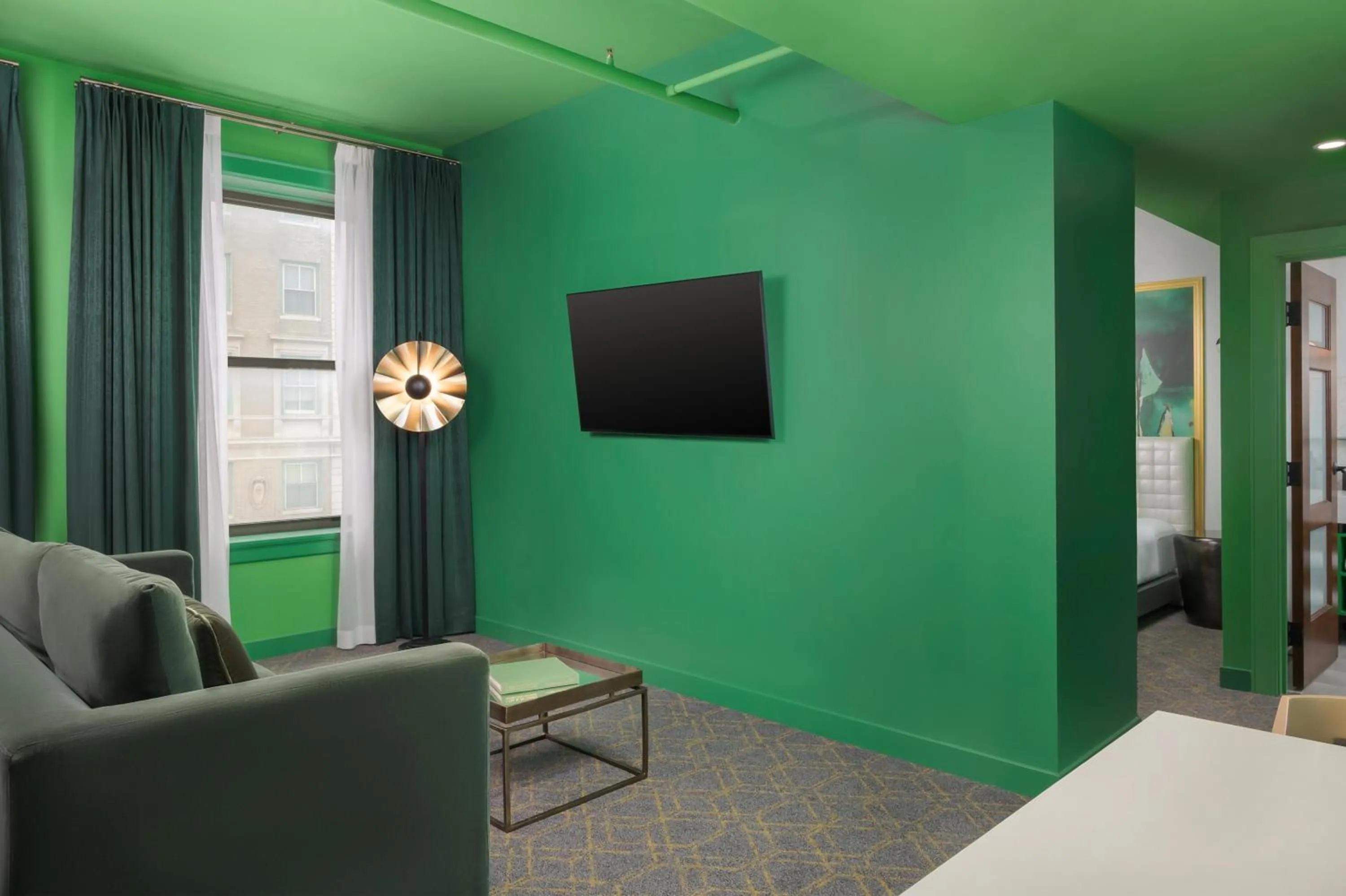 Living room, Bed in Angad Arts Hotel St Louis, Tapestry Collection by Hilton