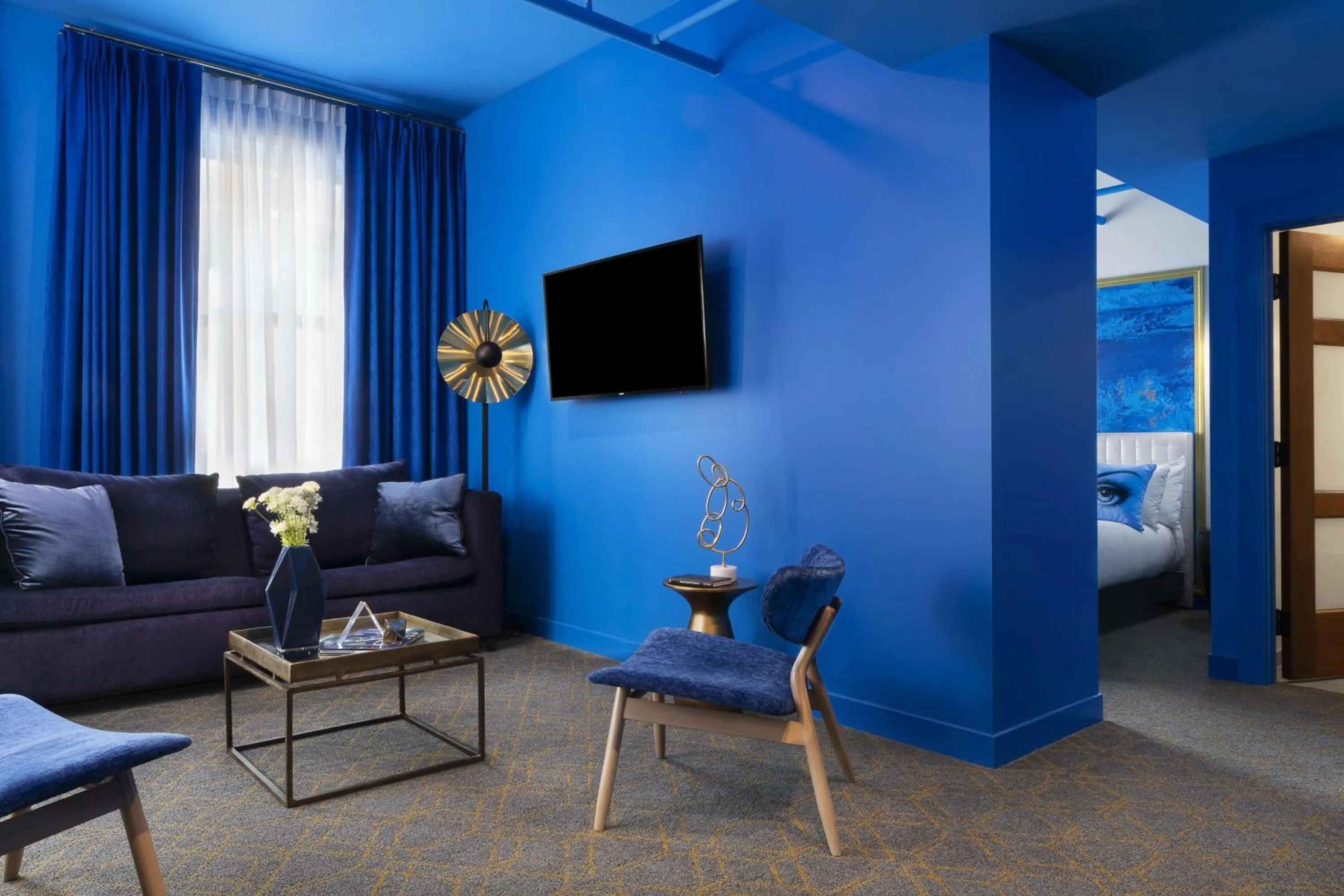 Living room in Angad Arts Hotel St Louis, Tapestry Collection by Hilton