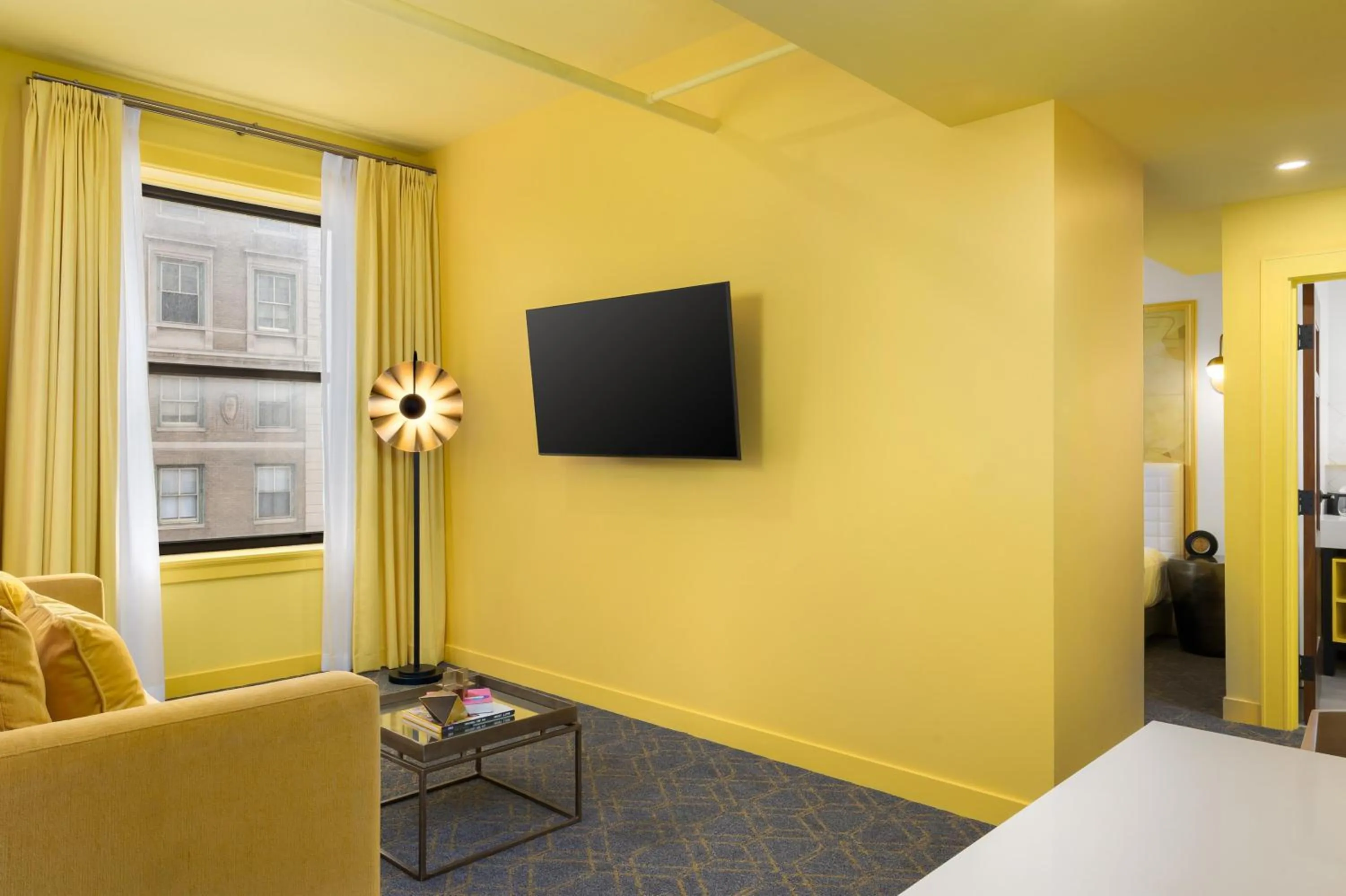 Living room in Angad Arts Hotel St Louis, Tapestry Collection by Hilton