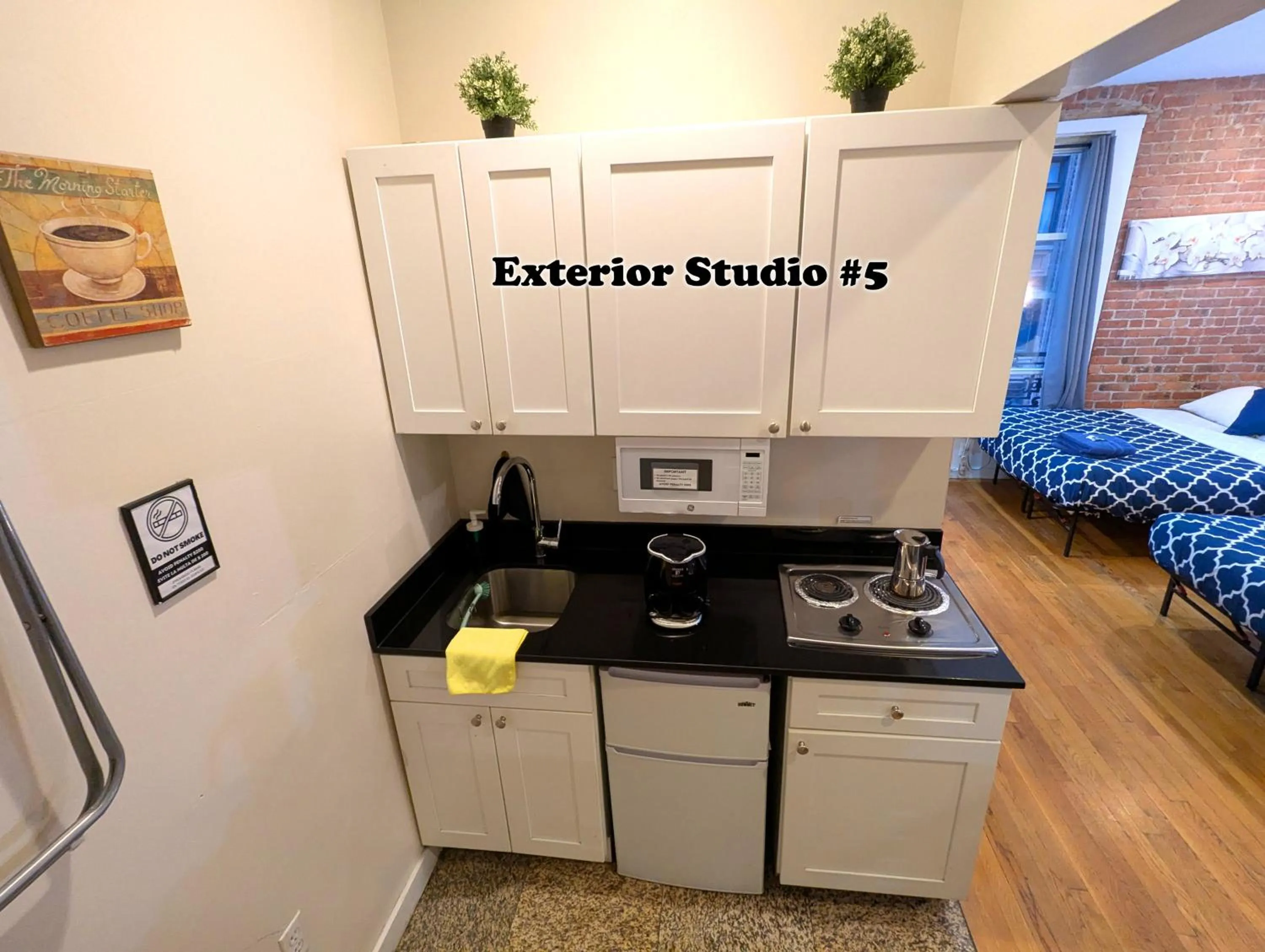 Kitchen or kitchenette in NYC Empire Apartments