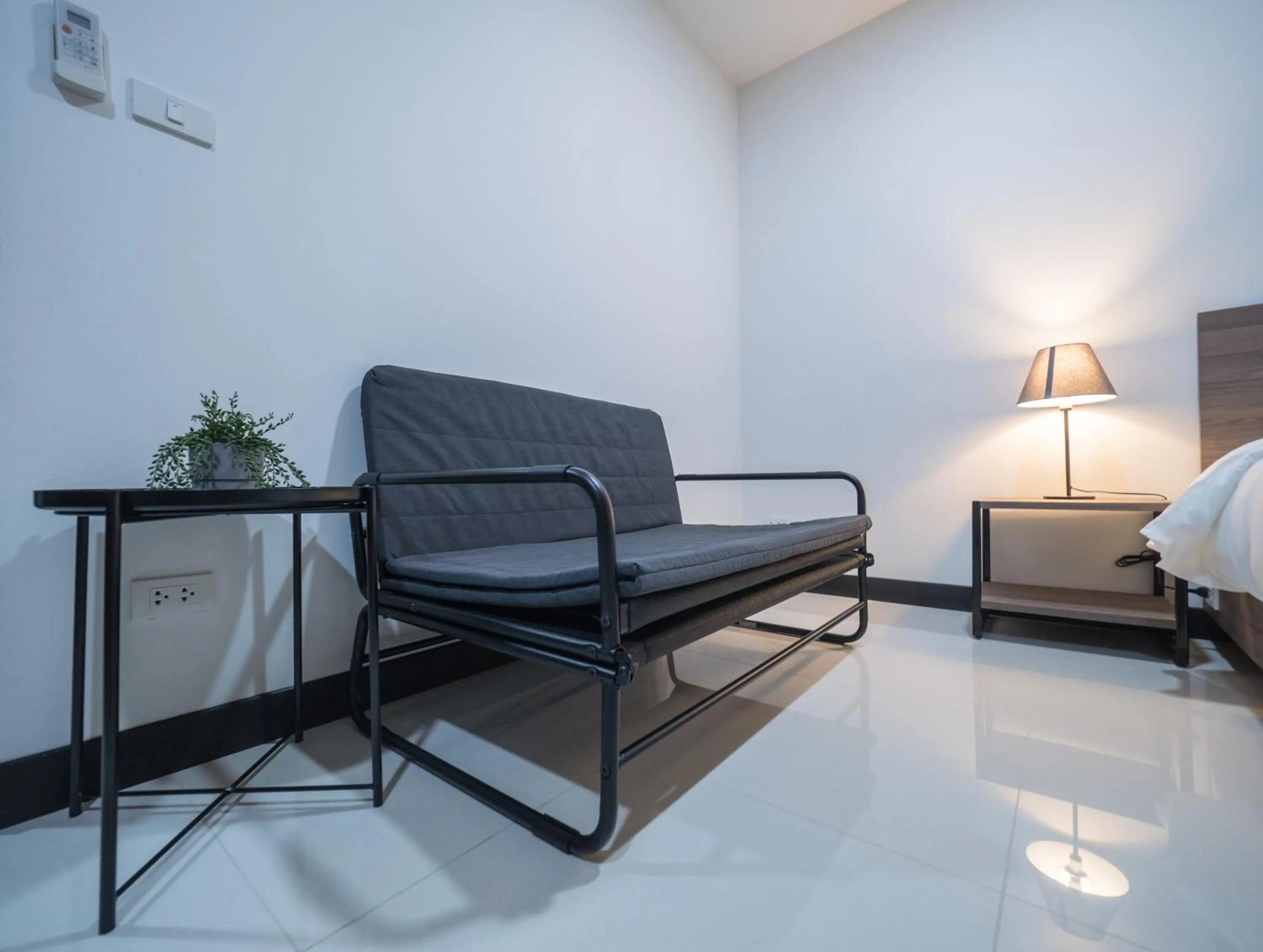 Seating area, Bed in Tassana Place