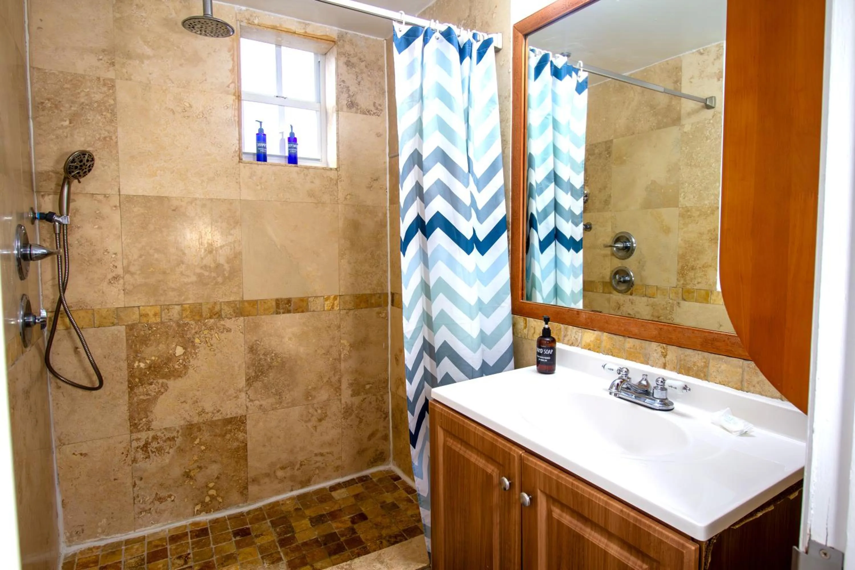 Shower in Hispaniola Apartments Part of the Oasis Casita Collection