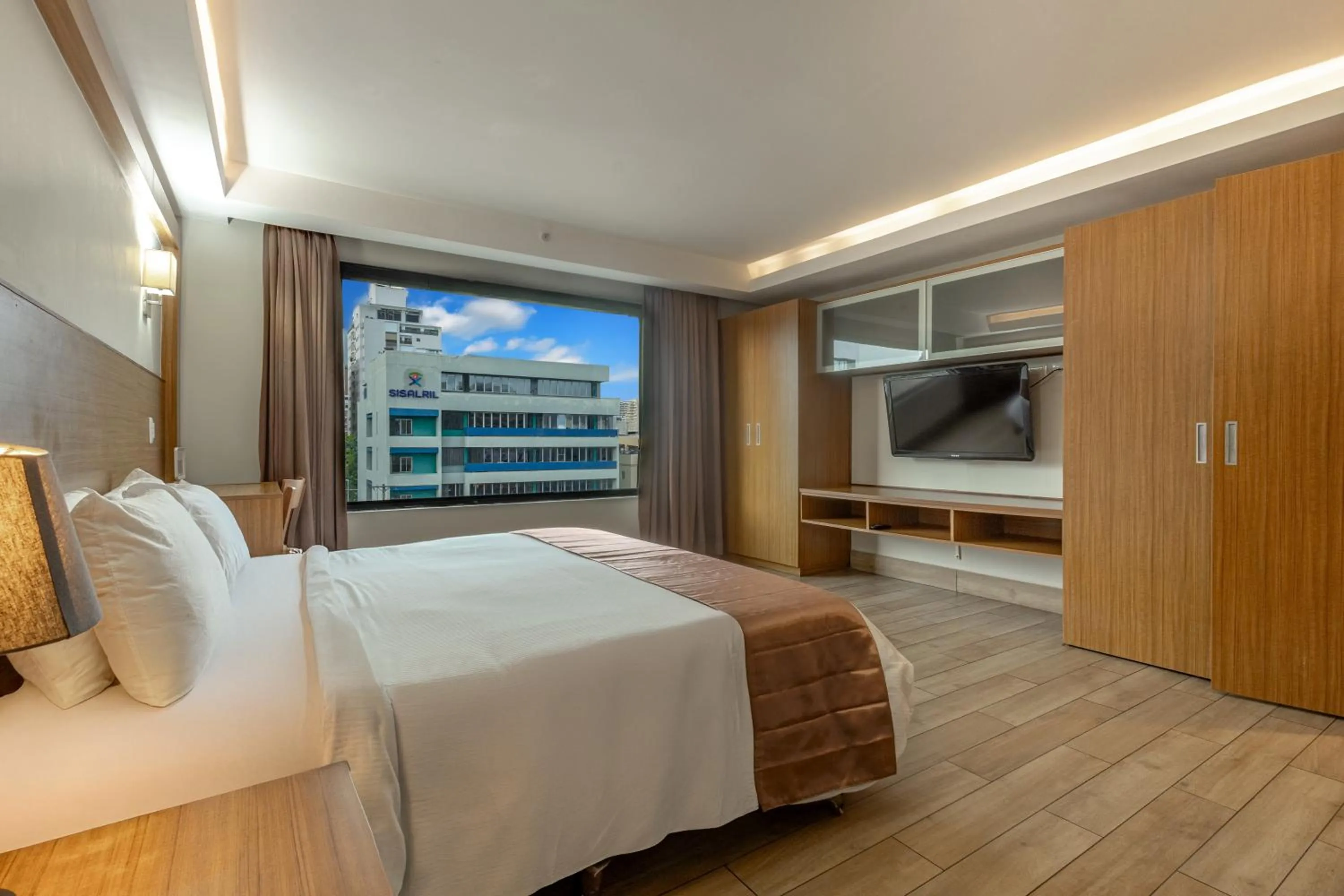 Bed in Weston Suites Hotel