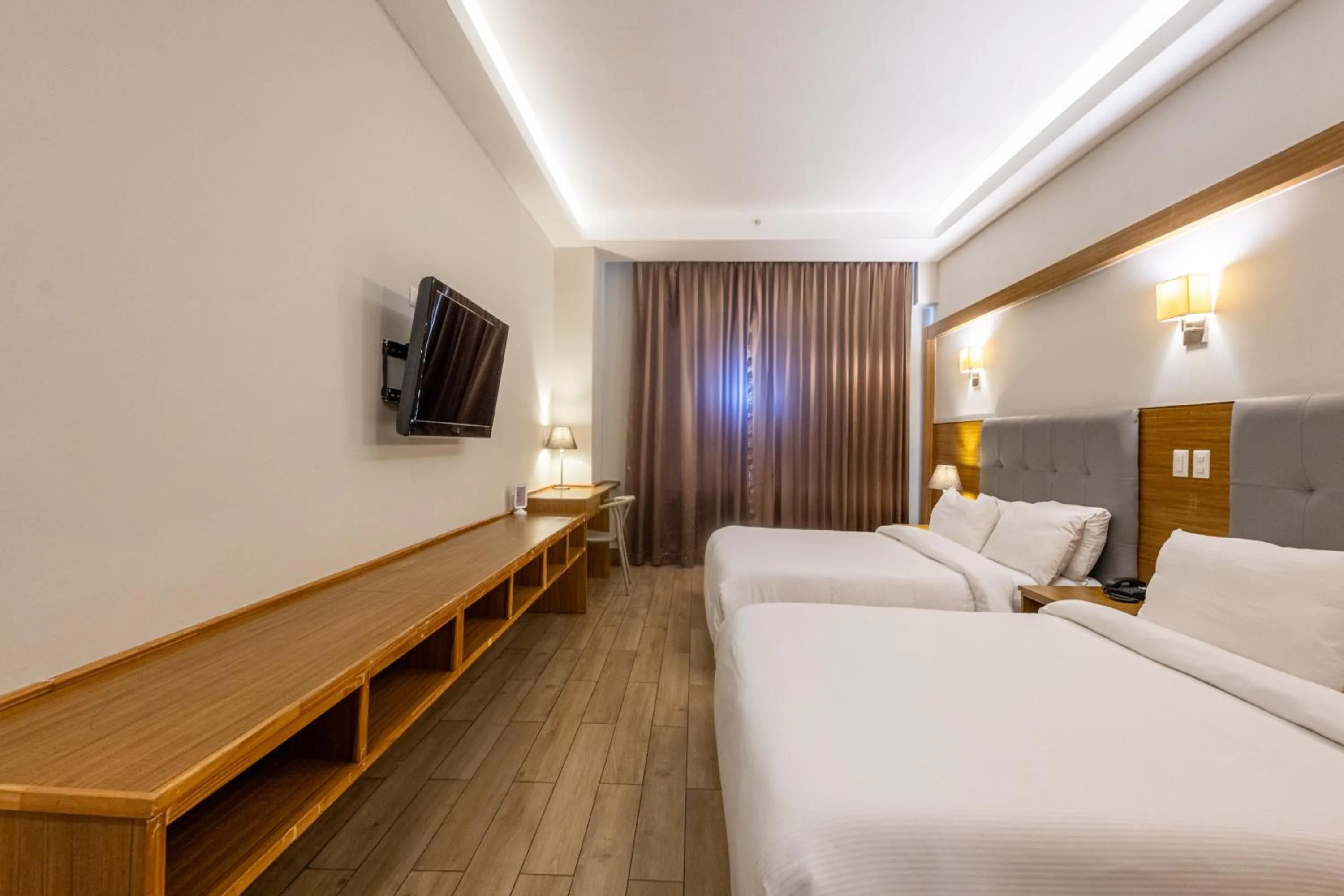 Bed in Weston Suites Hotel