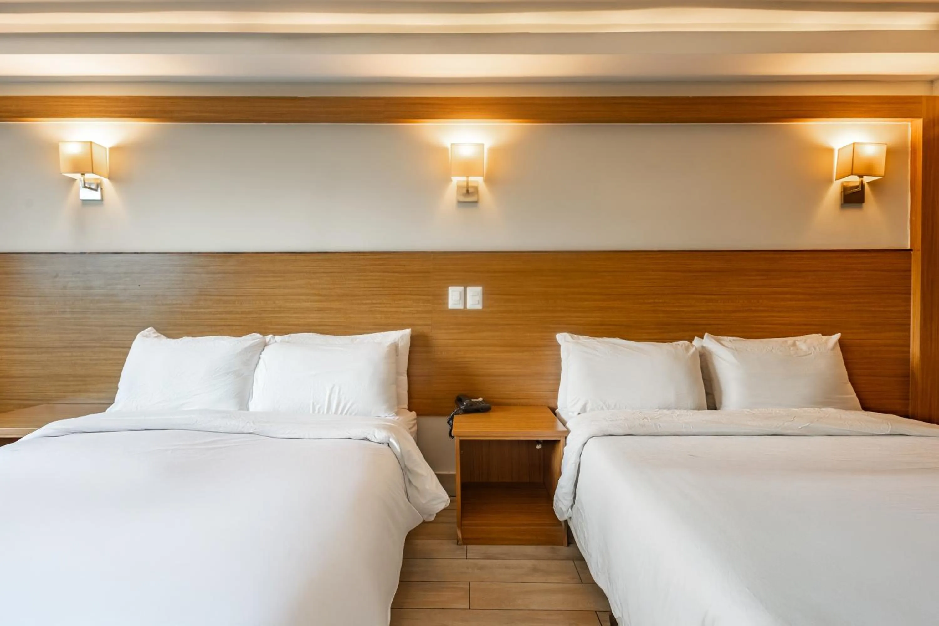 Bed in Weston Suites Hotel