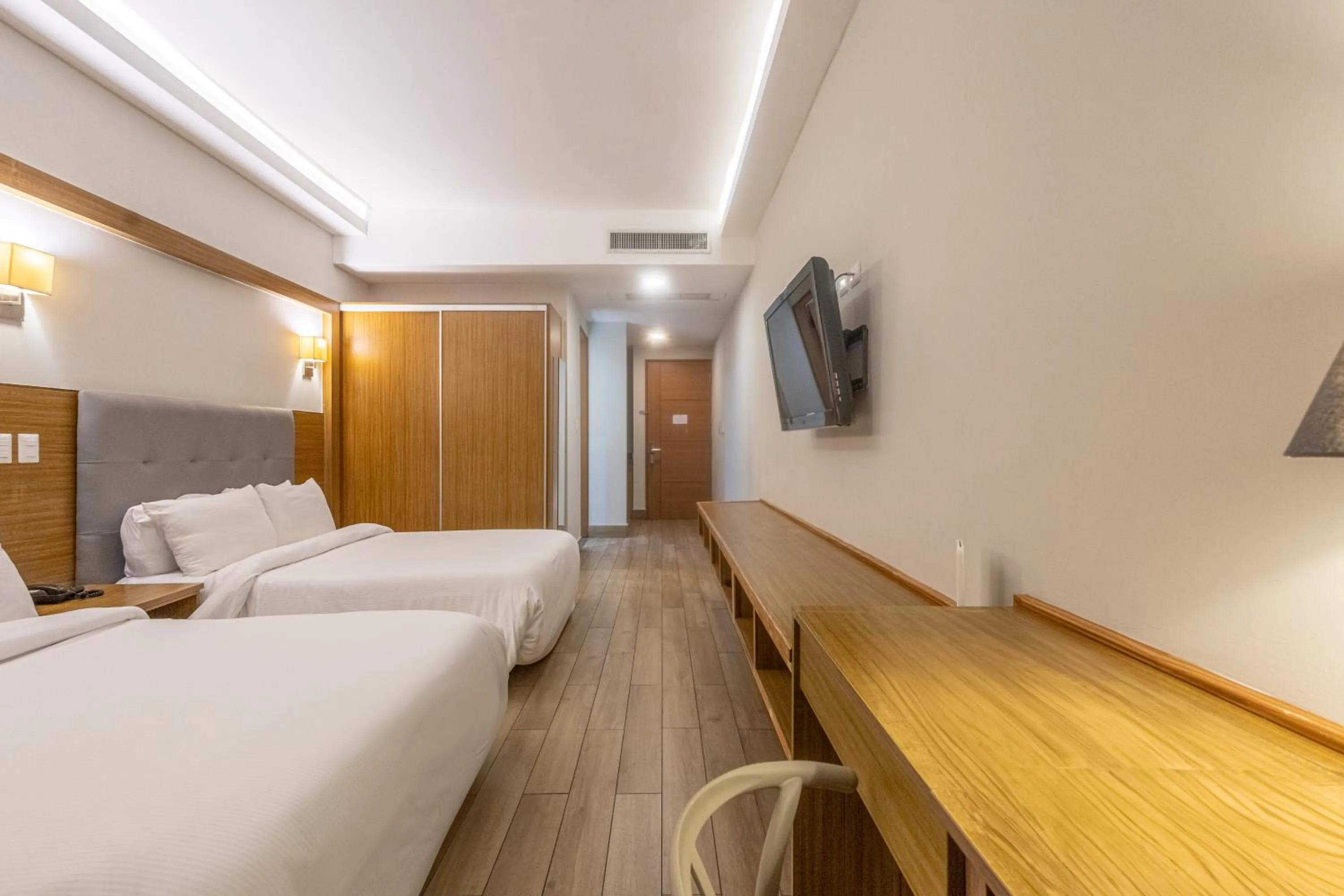 Bed in Weston Suites Hotel