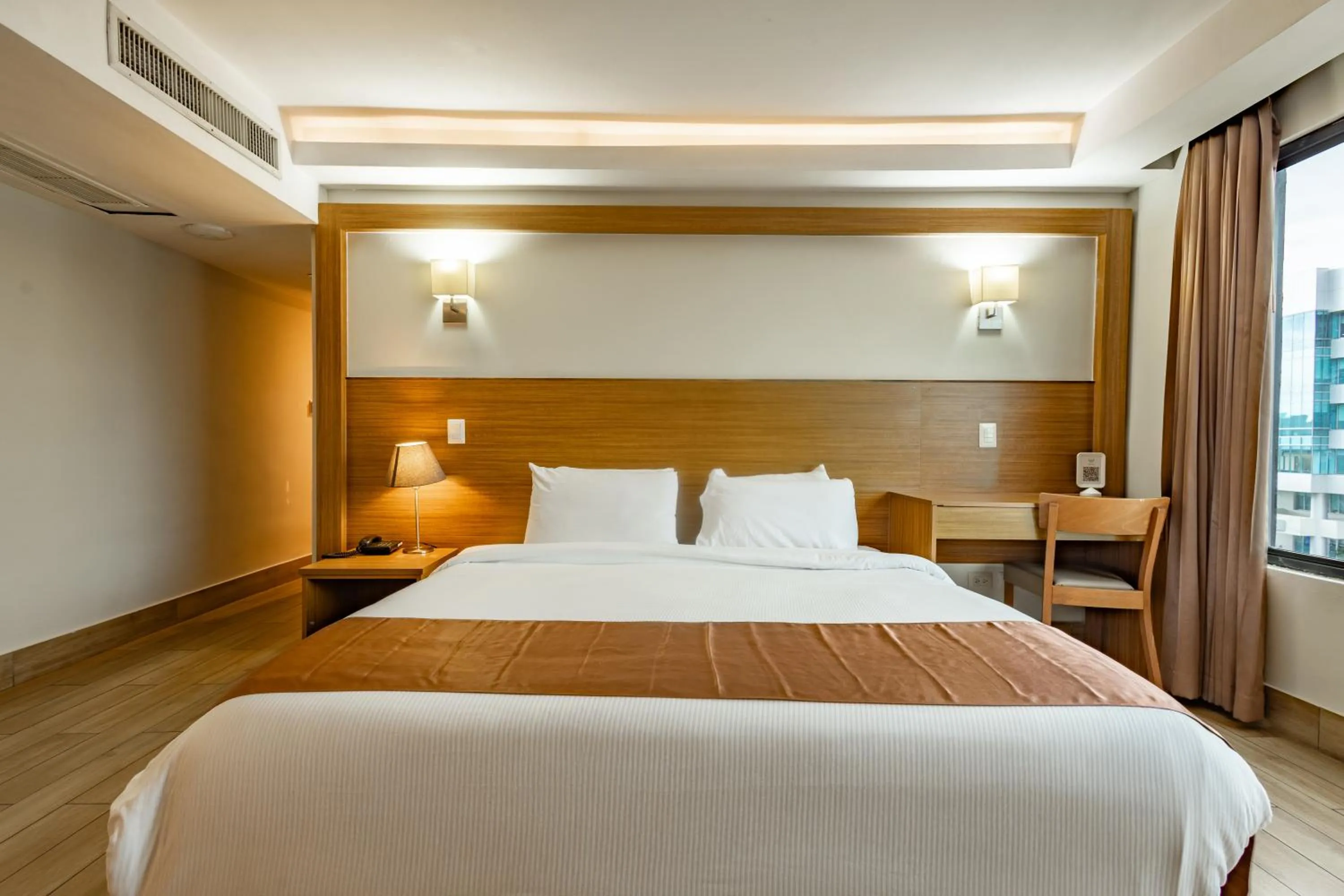 Bed in Weston Suites Hotel