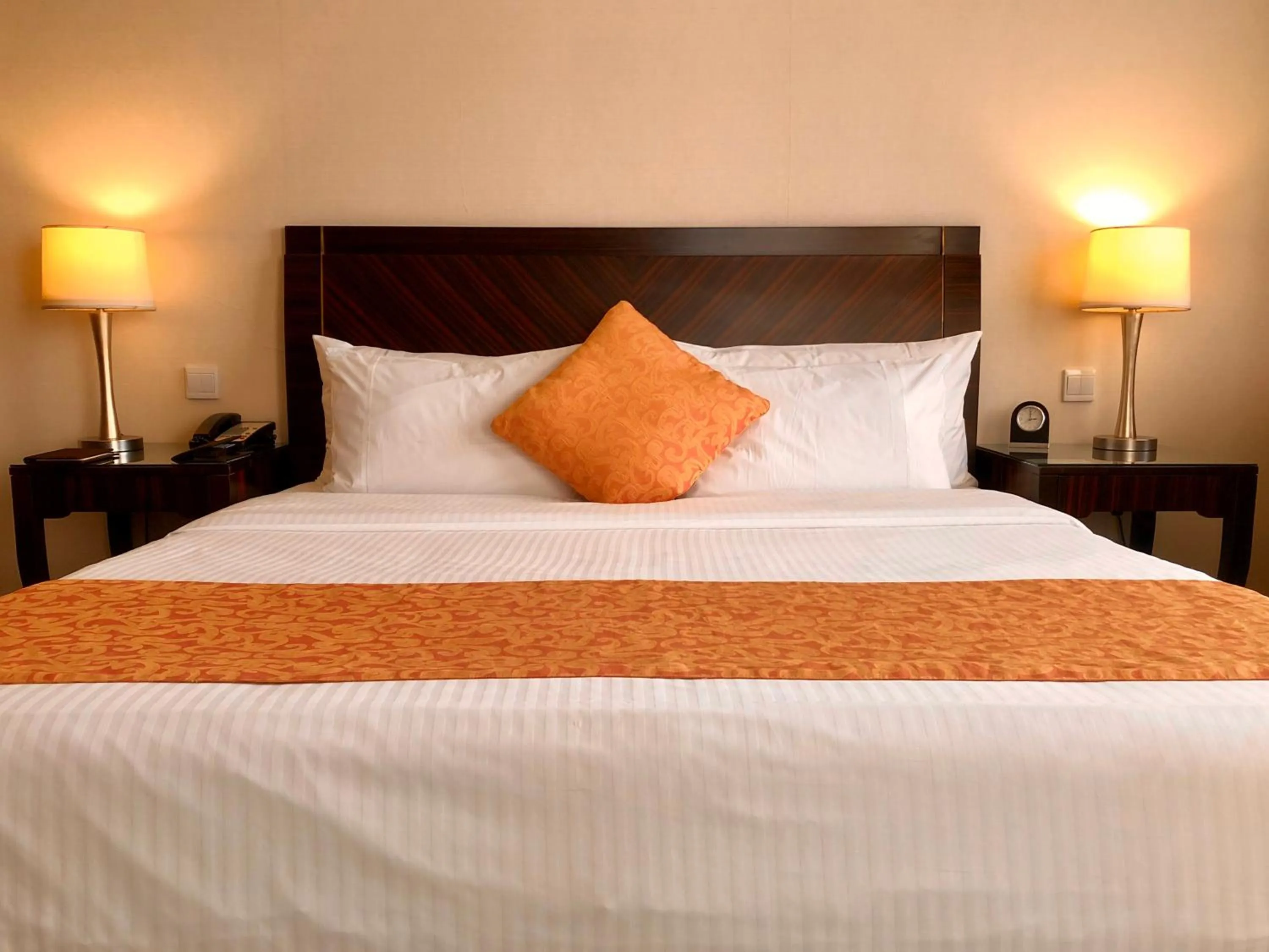 Bed in Ningbo Portman Plaza Hotel