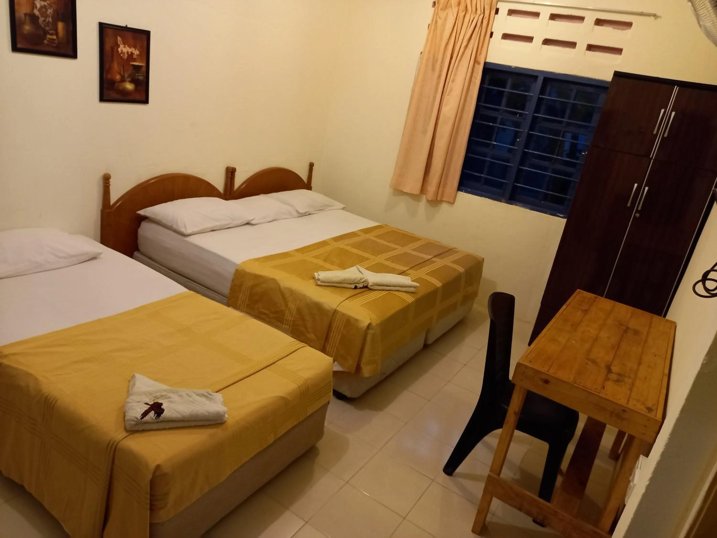 Photo of the whole room, Bed in THE COTTAGE LANGKAWI