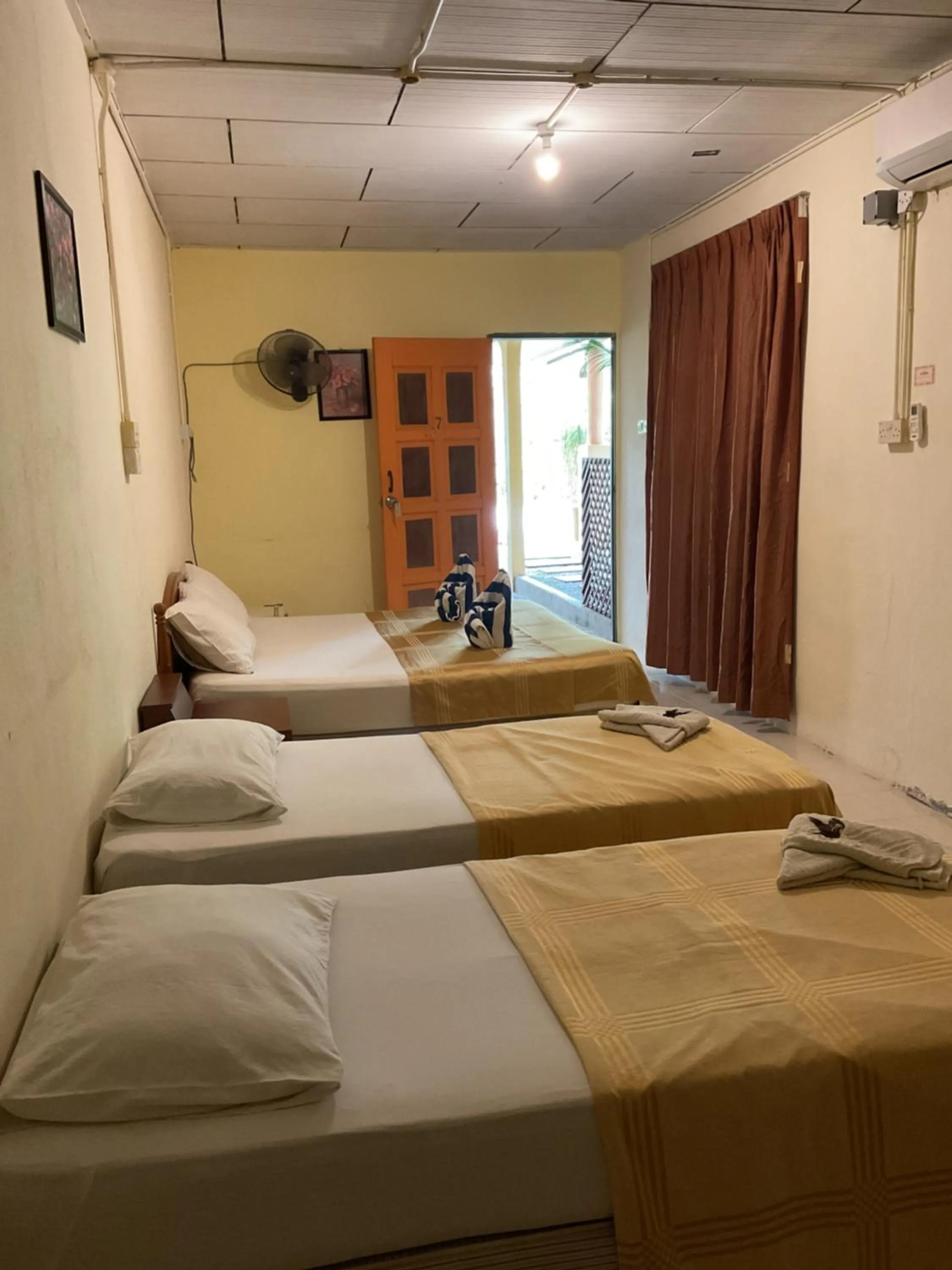 Bed in THE COTTAGE LANGKAWI