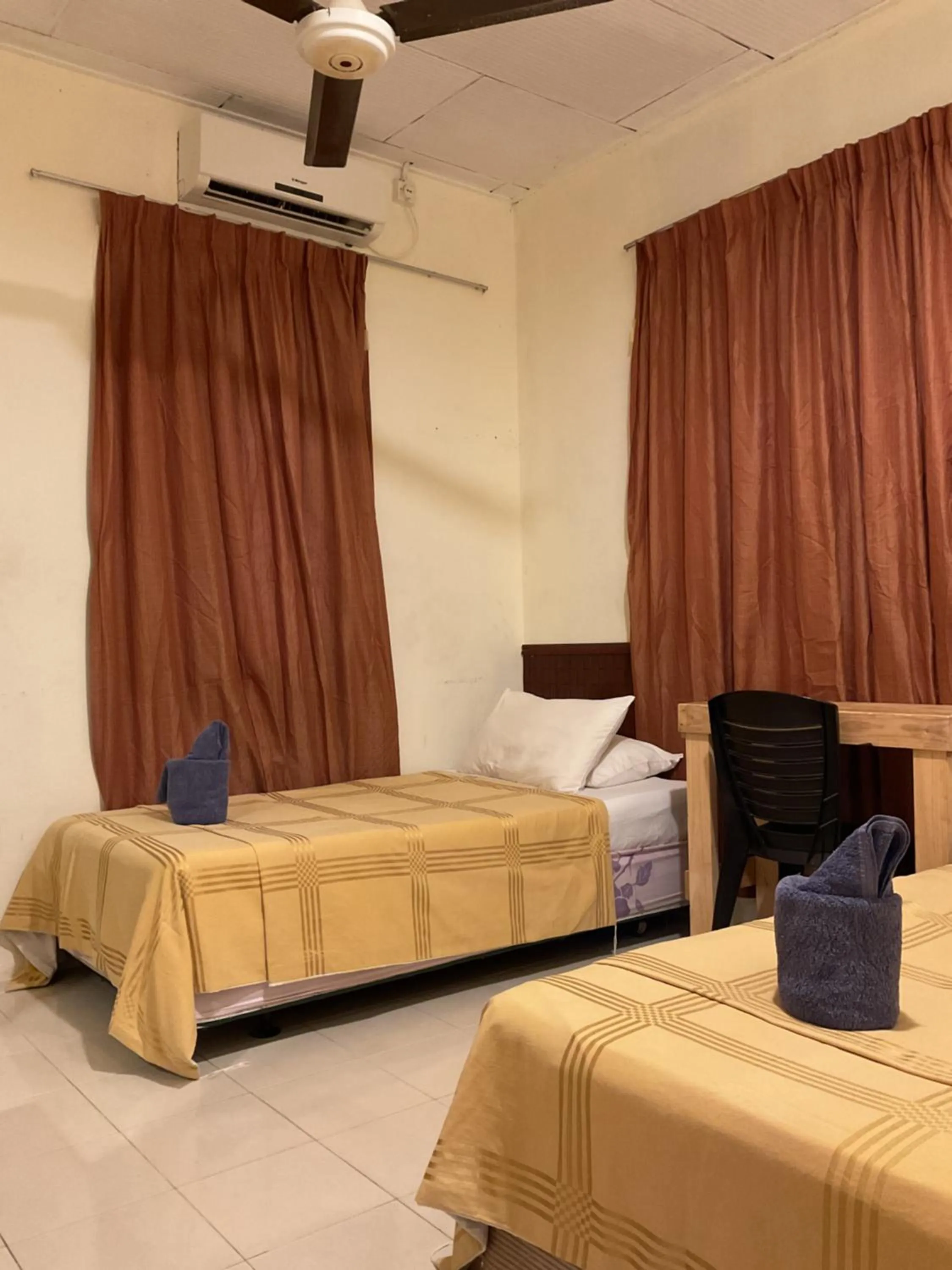 Bed in THE COTTAGE LANGKAWI