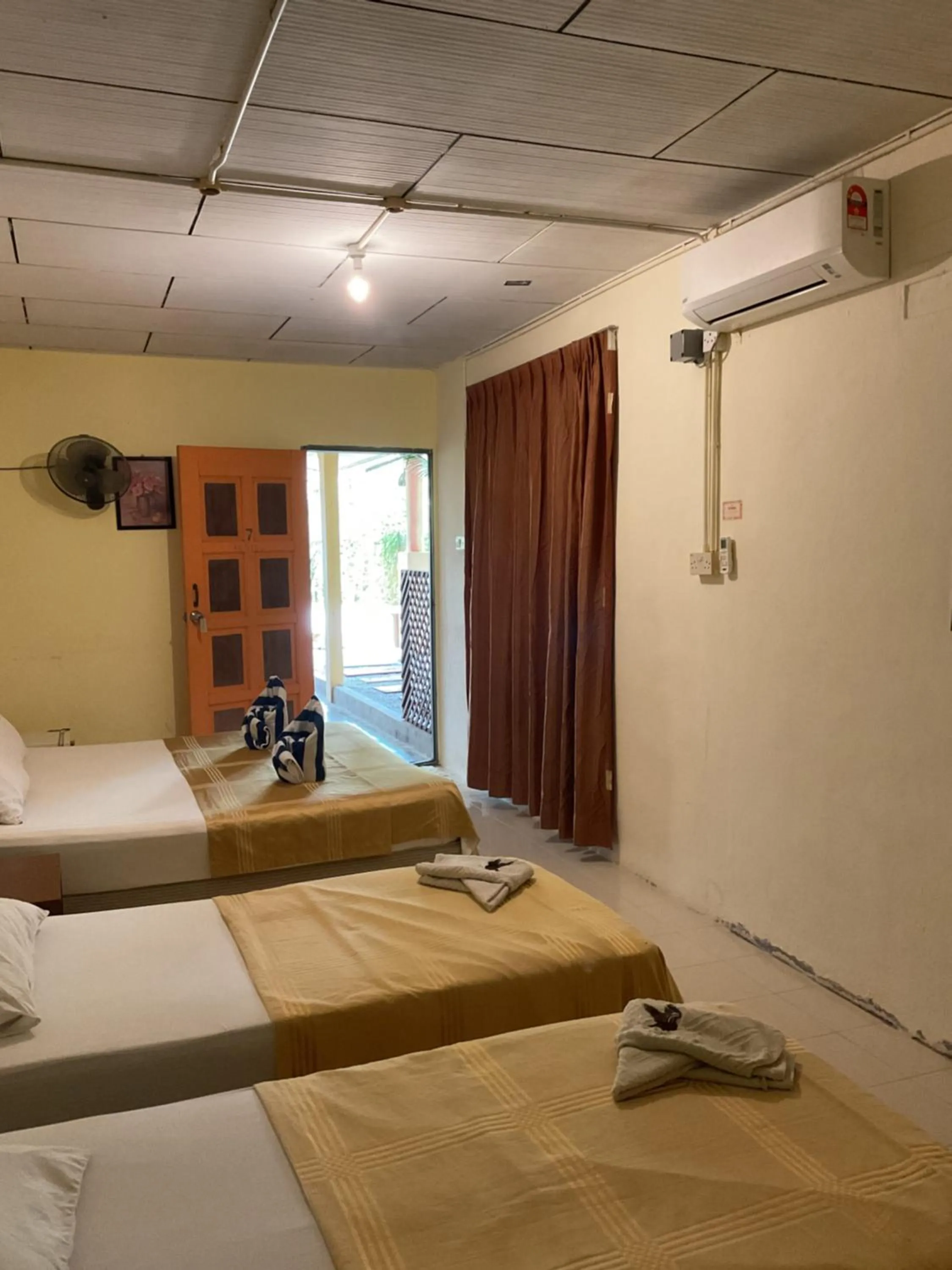 Bed in THE COTTAGE LANGKAWI