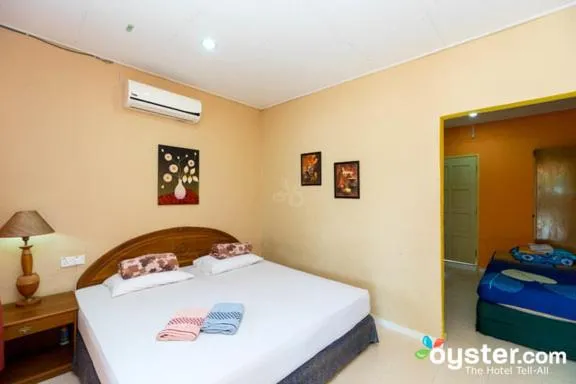 Bed in THE COTTAGE LANGKAWI