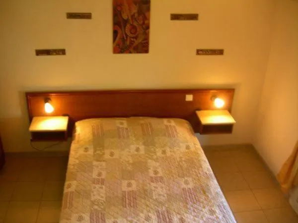 Bed in Hôtel de la Madeleine Anduze