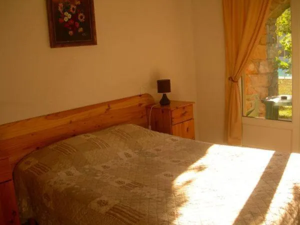 Bed in Hôtel de la Madeleine Anduze