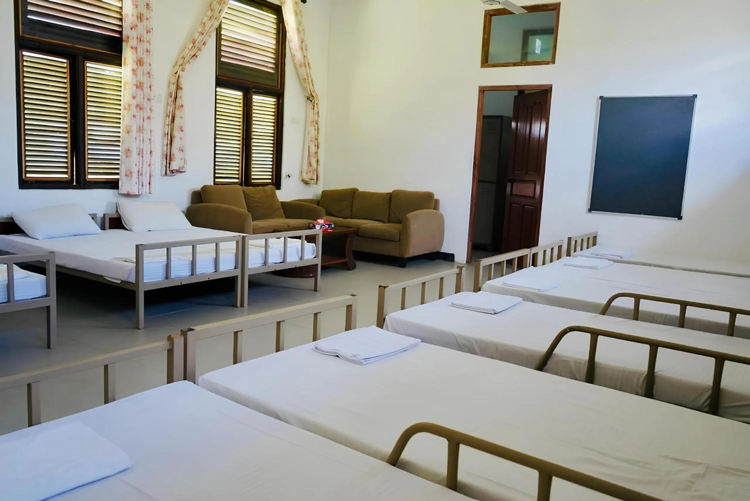 Living room, Bed in Amaluna Resorts