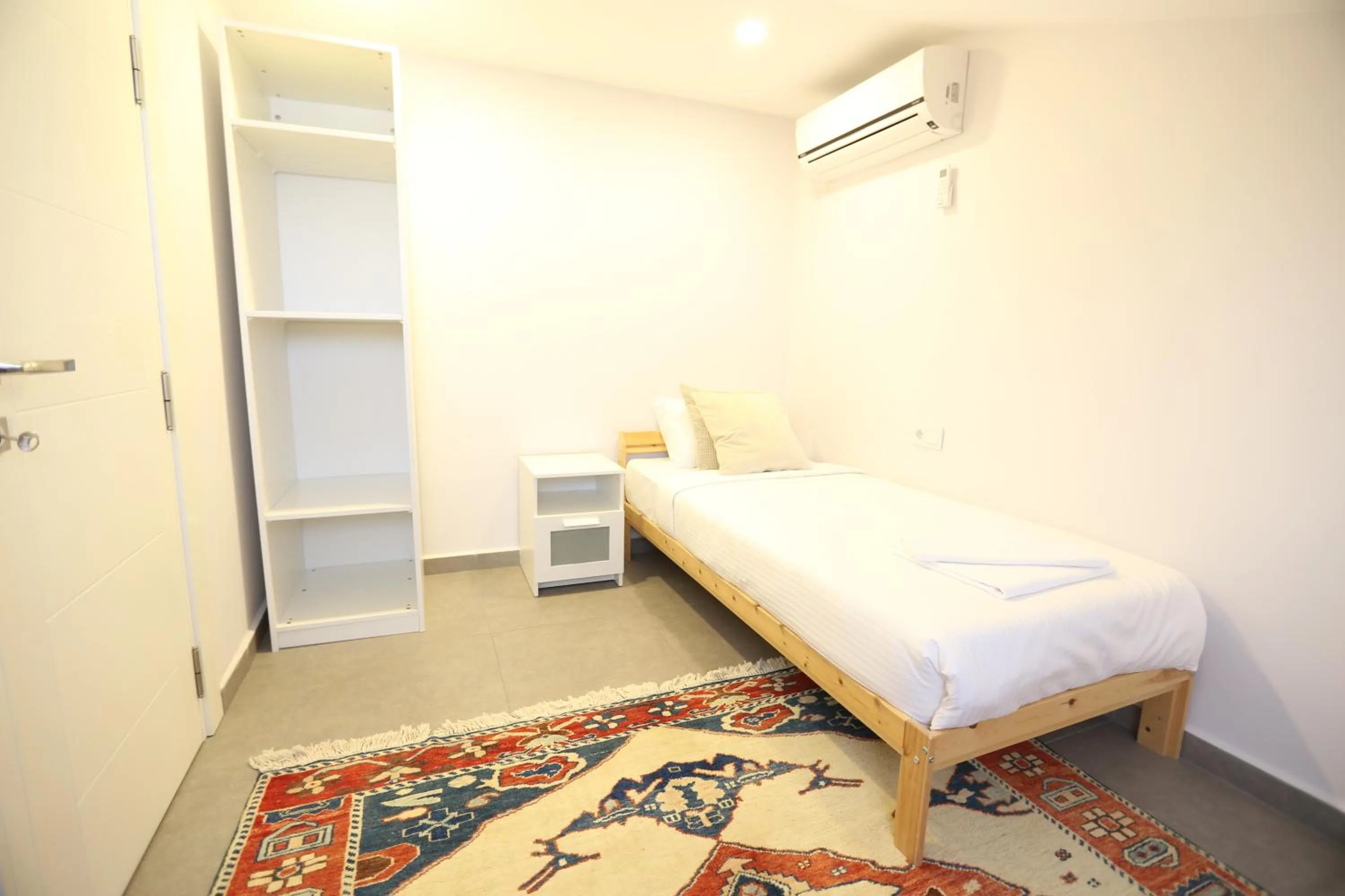 Bed in Truemar Hotels & Suites