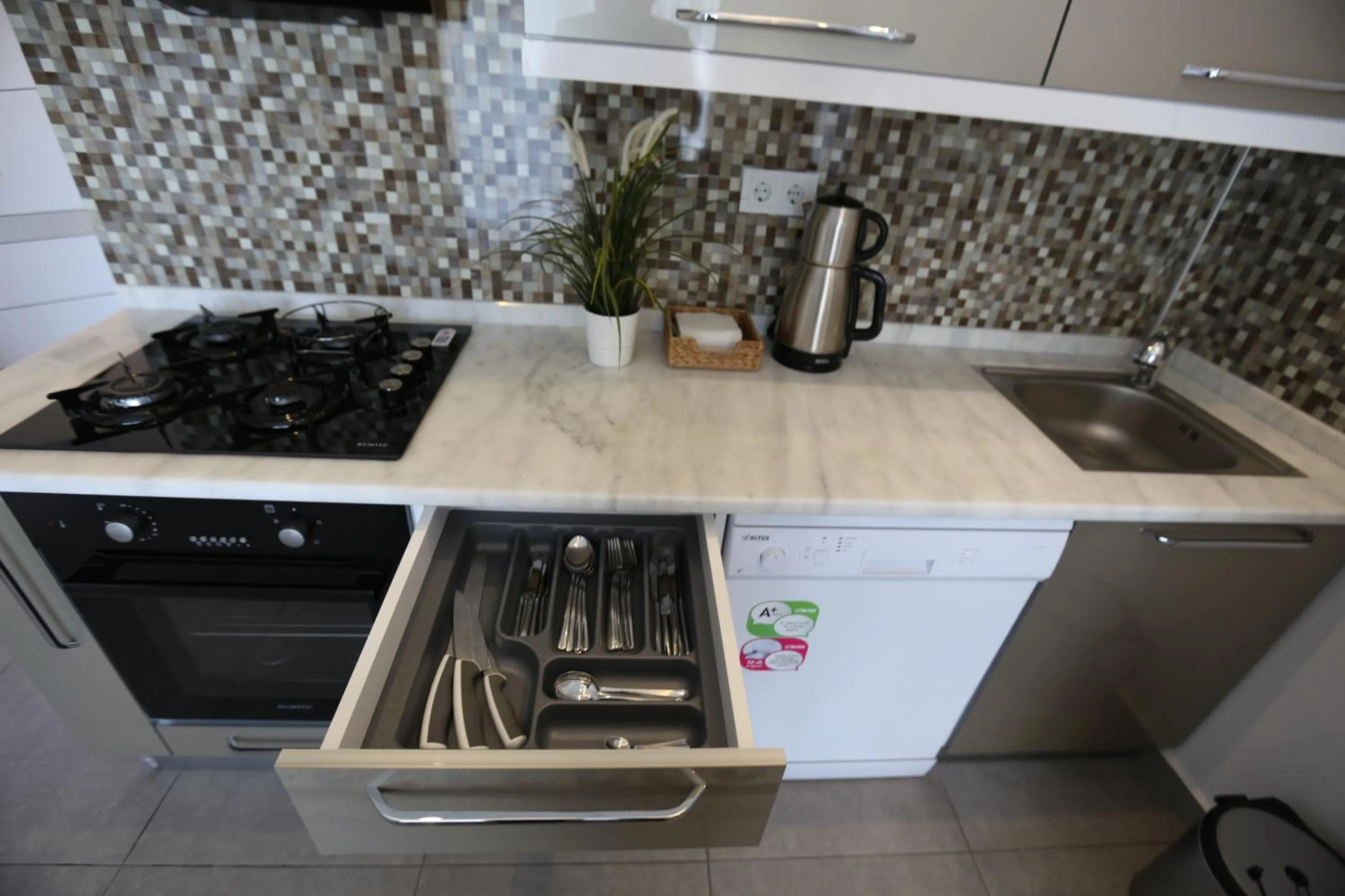 Kitchen or kitchenette in Truemar Hotels & Suites