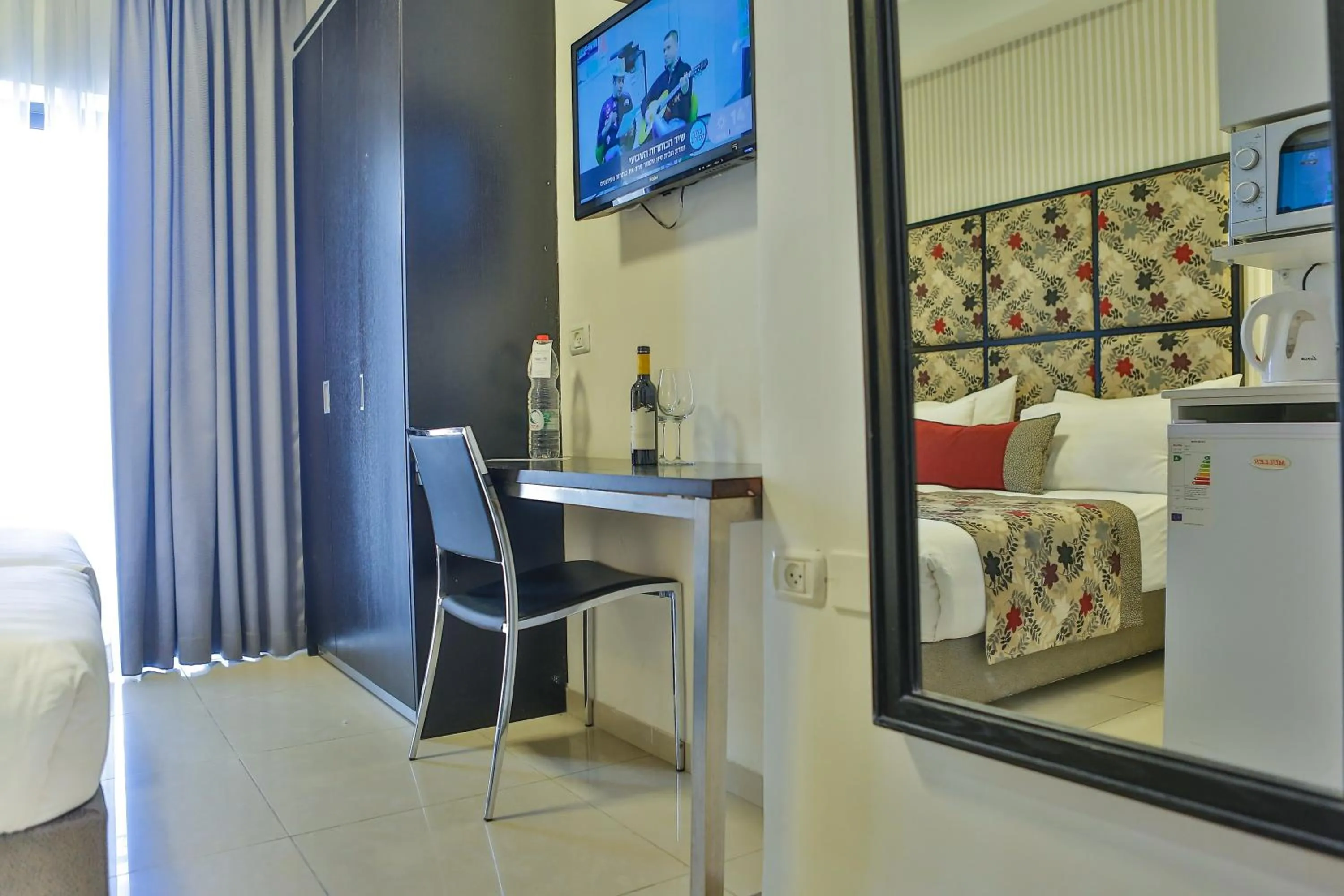 Bedroom, TV/Entertainment Center in Shamai Suites Jerusalem