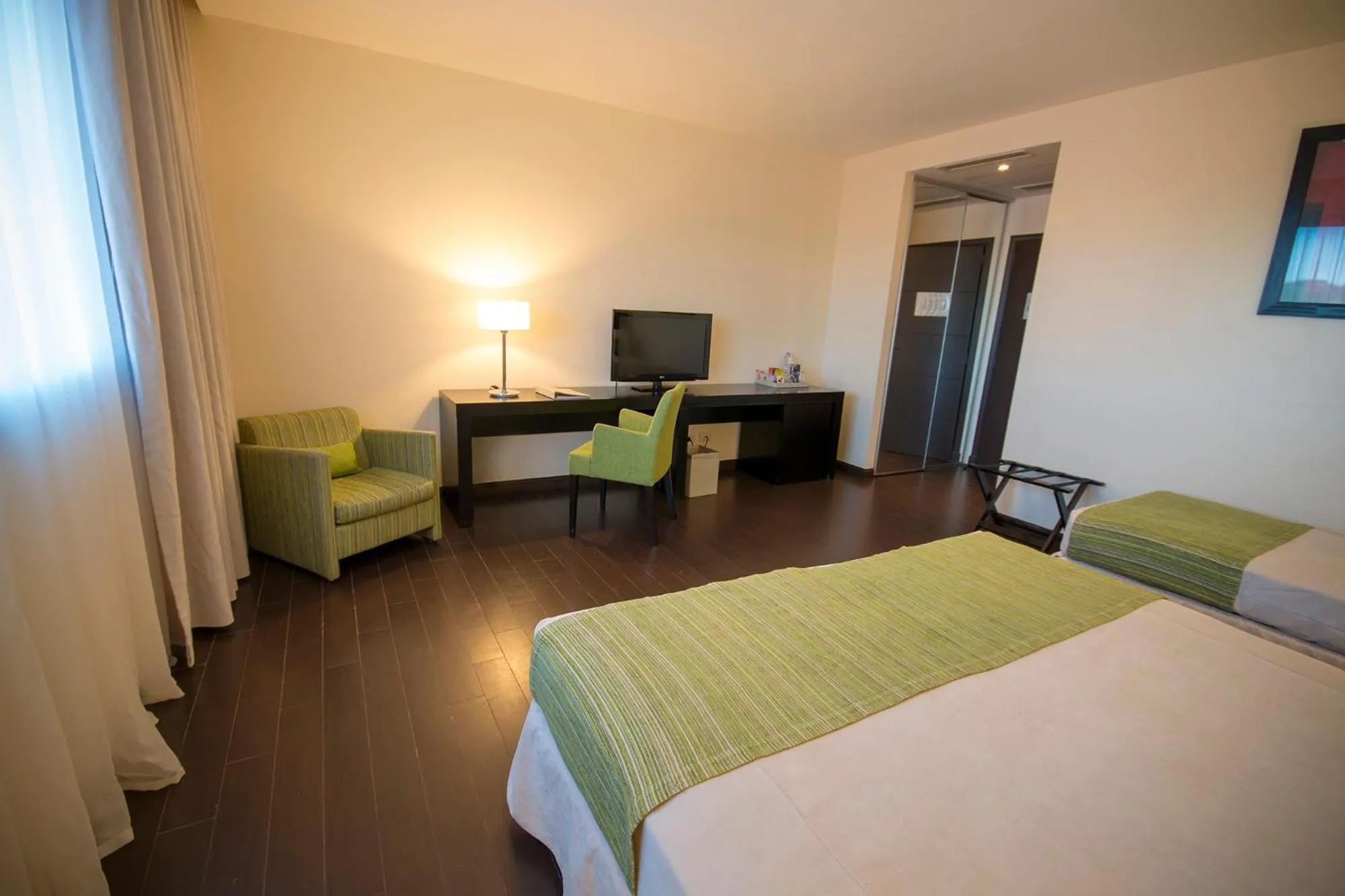 Bed in Grand Crucero Hotel