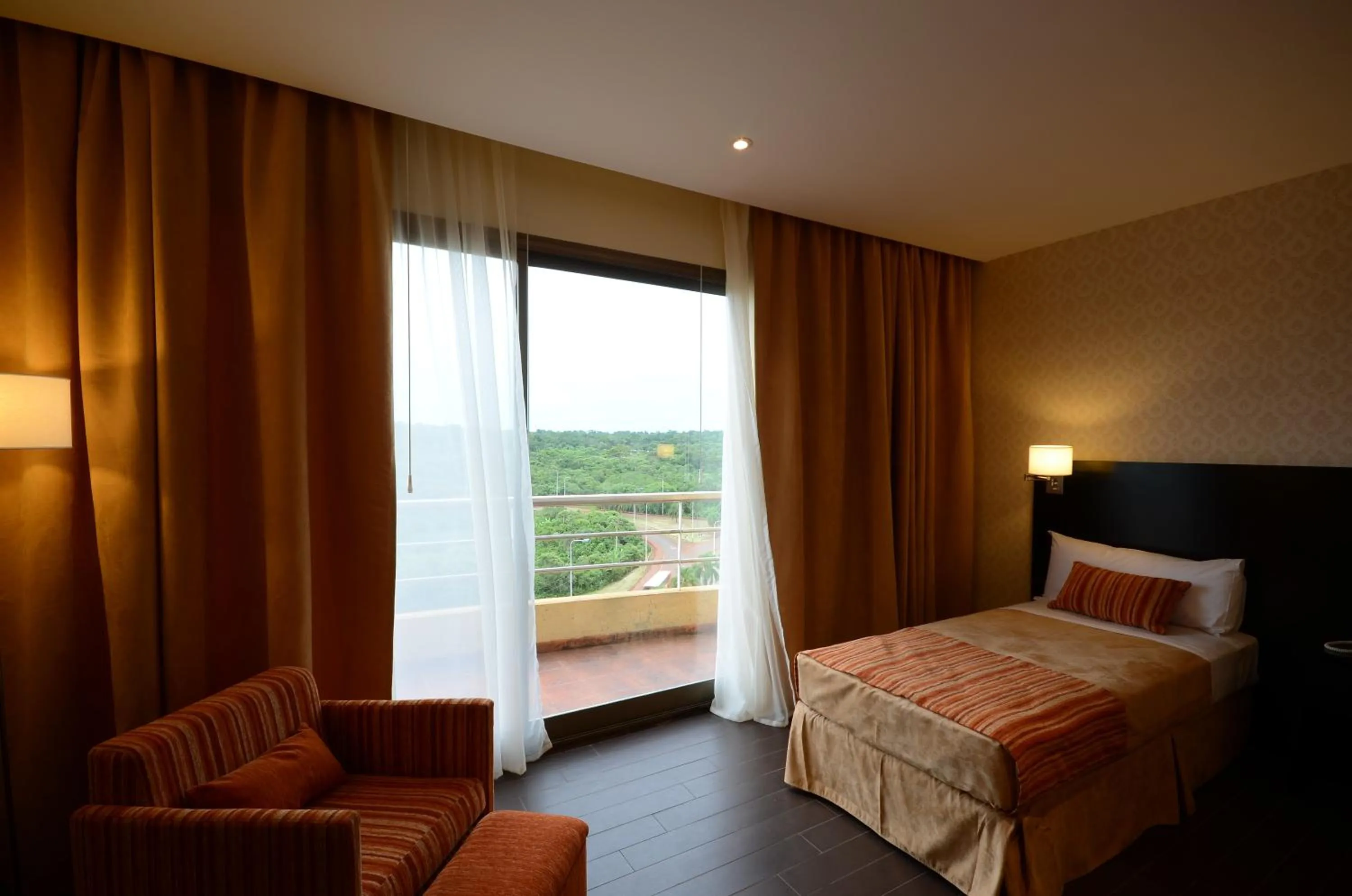 Bed in Grand Crucero Hotel