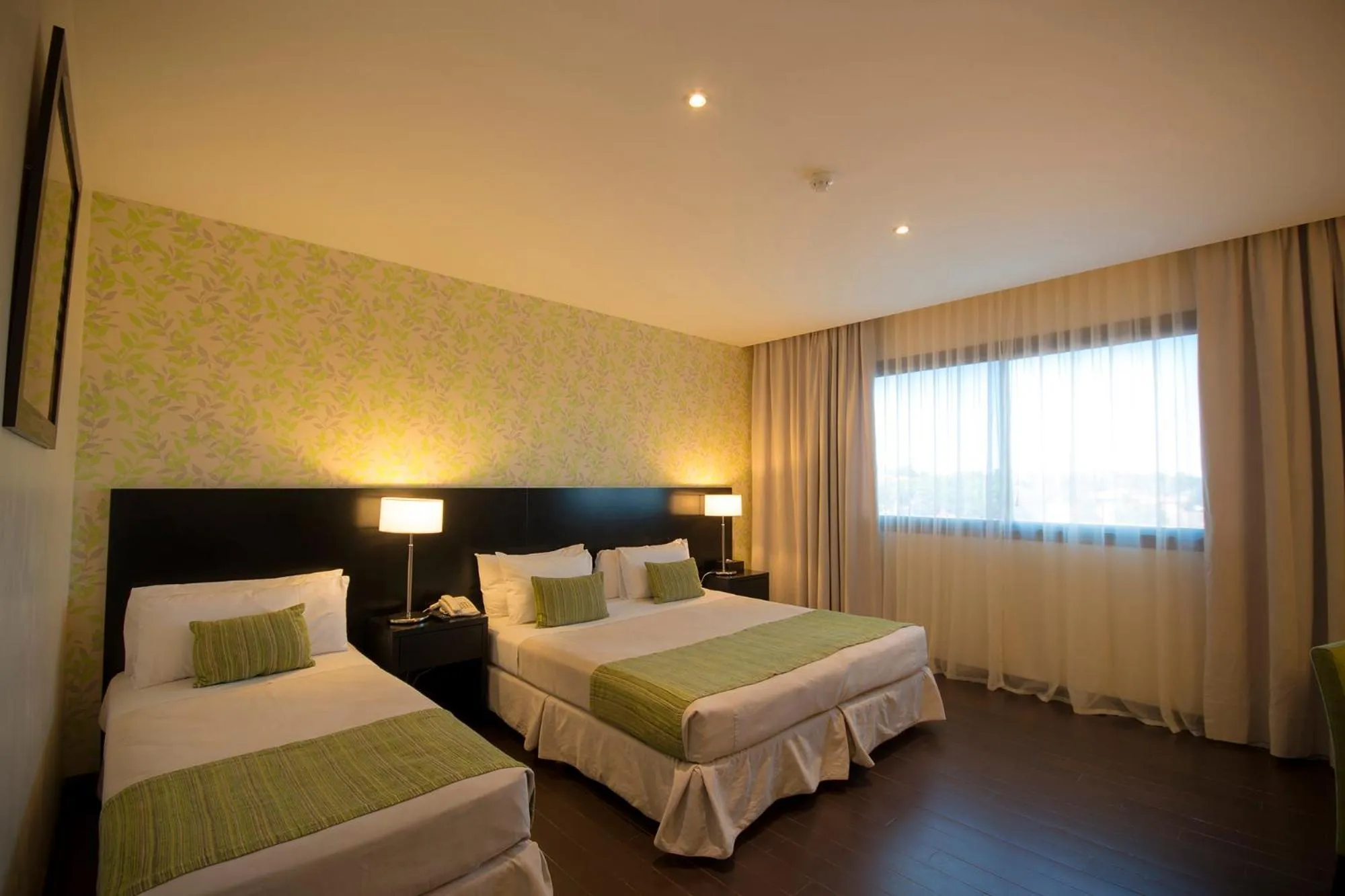 Bed in Grand Crucero Hotel