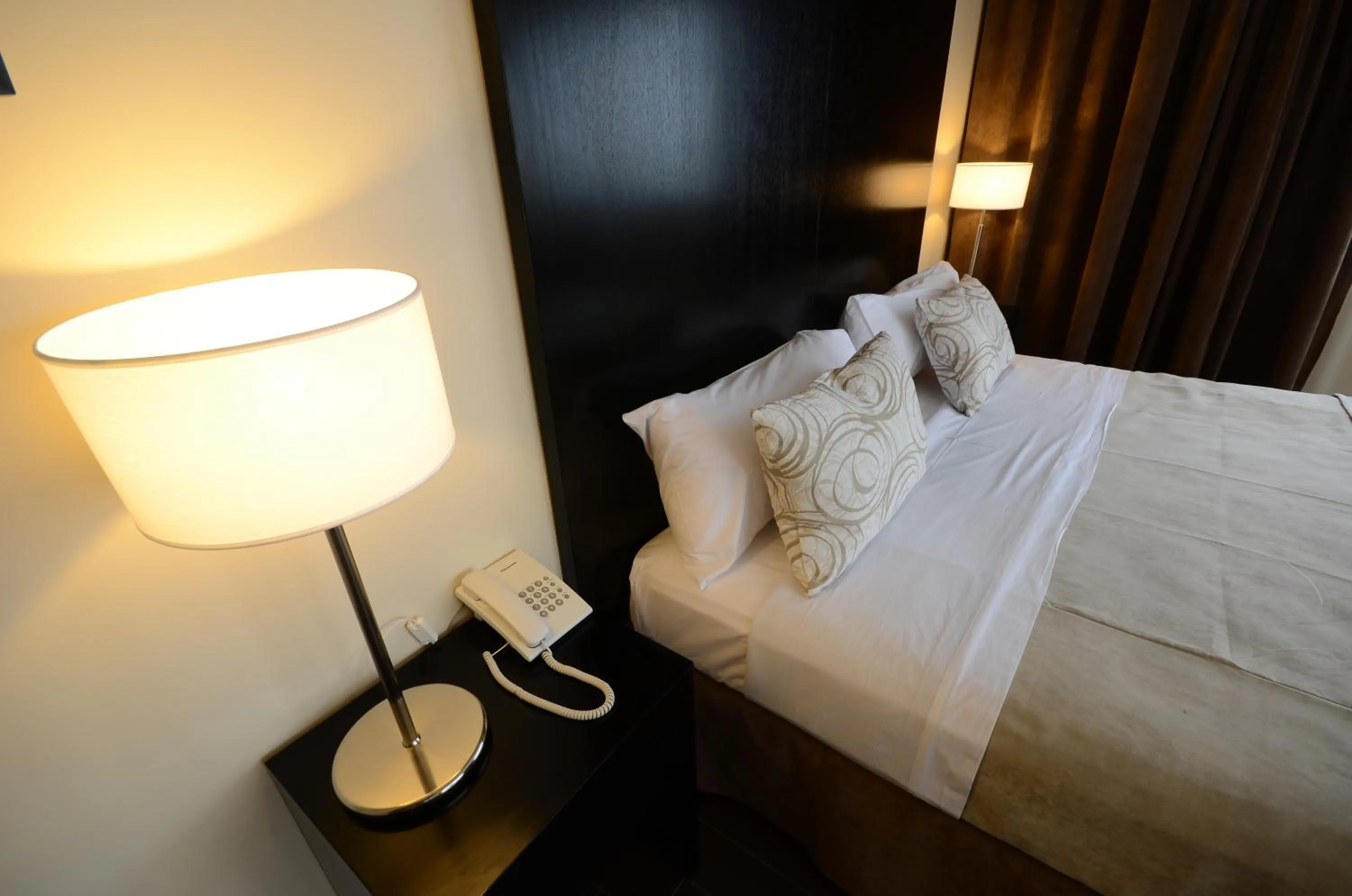 Bed in Grand Crucero Hotel