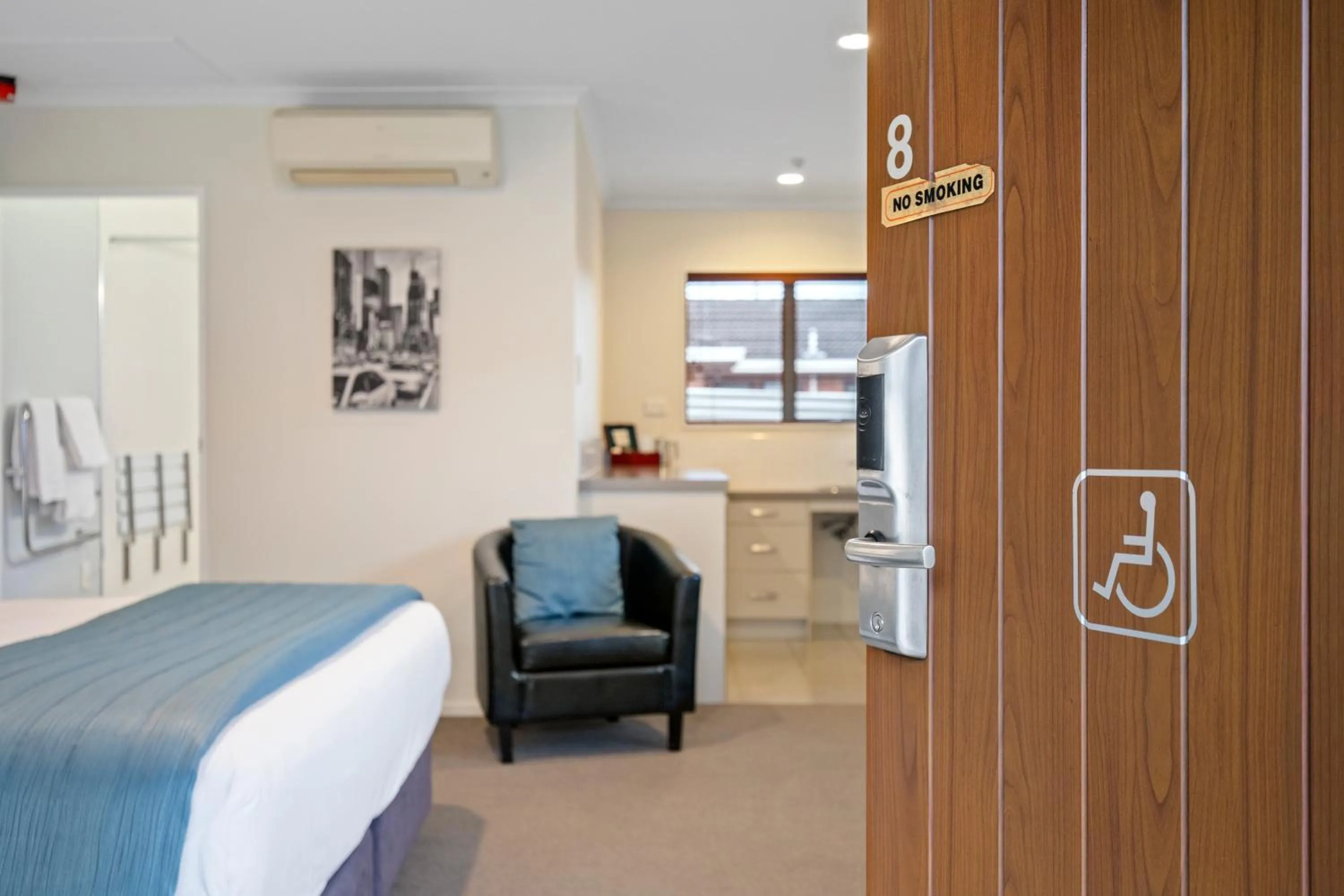 Bed in ASURE Aveda Motor Lodge