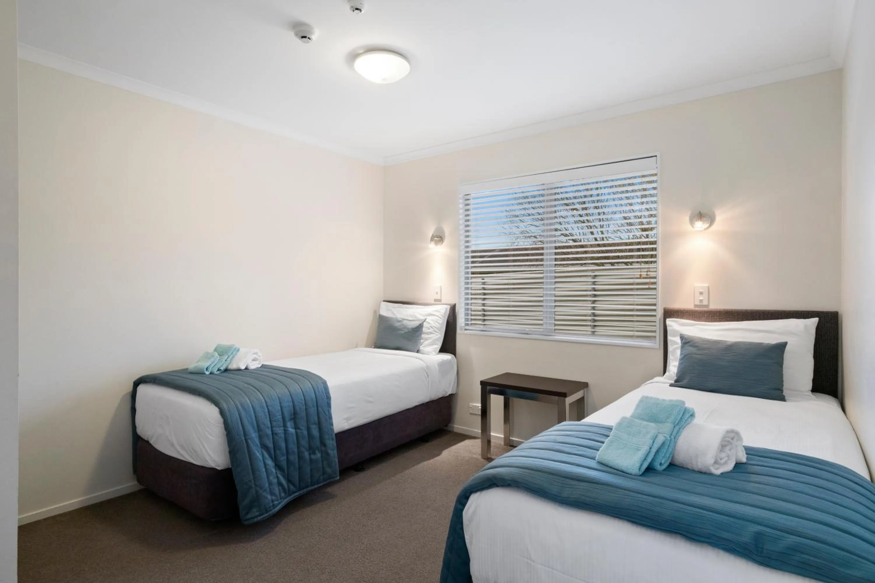 Bed in ASURE Aveda Motor Lodge