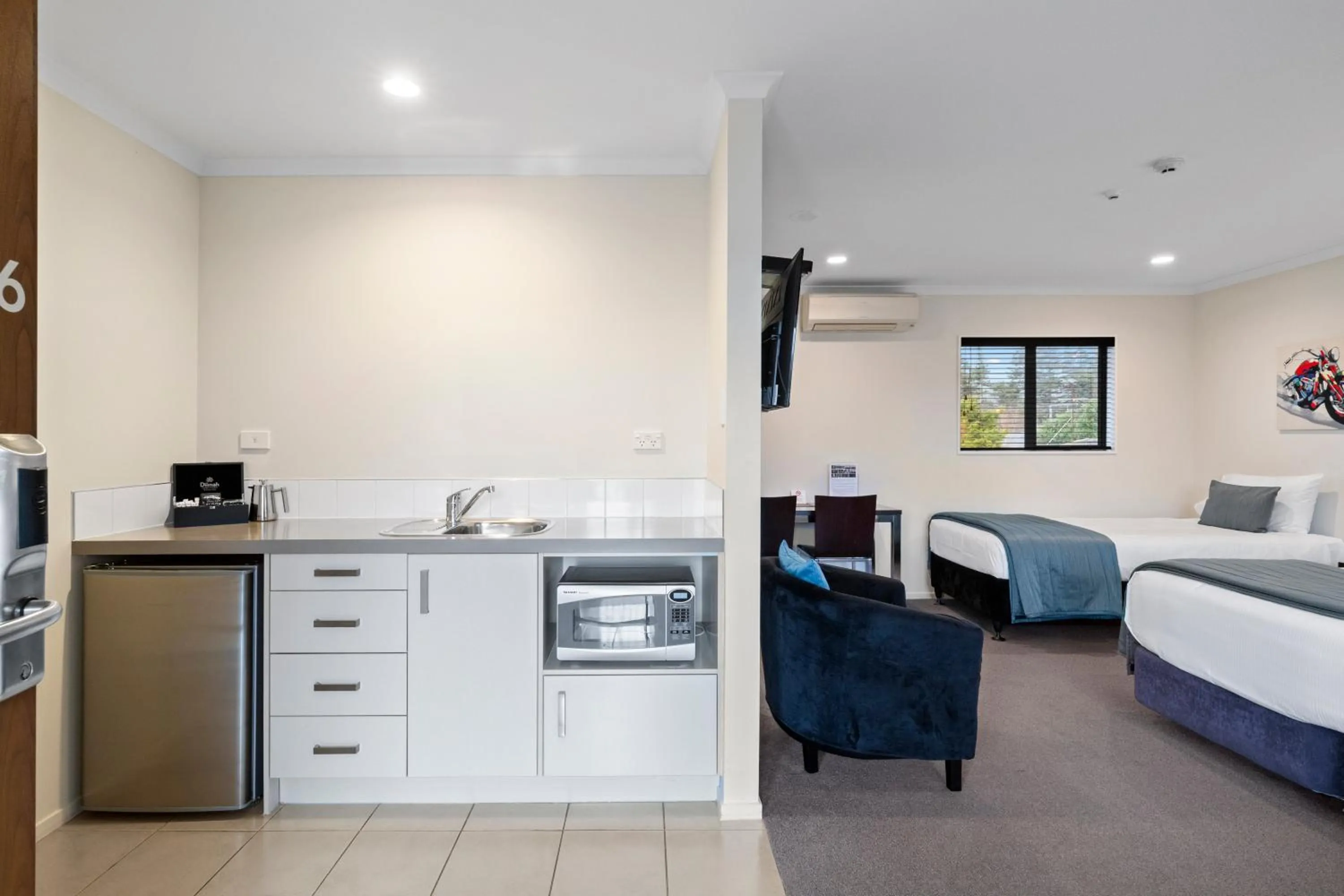 Bed in ASURE Aveda Motor Lodge