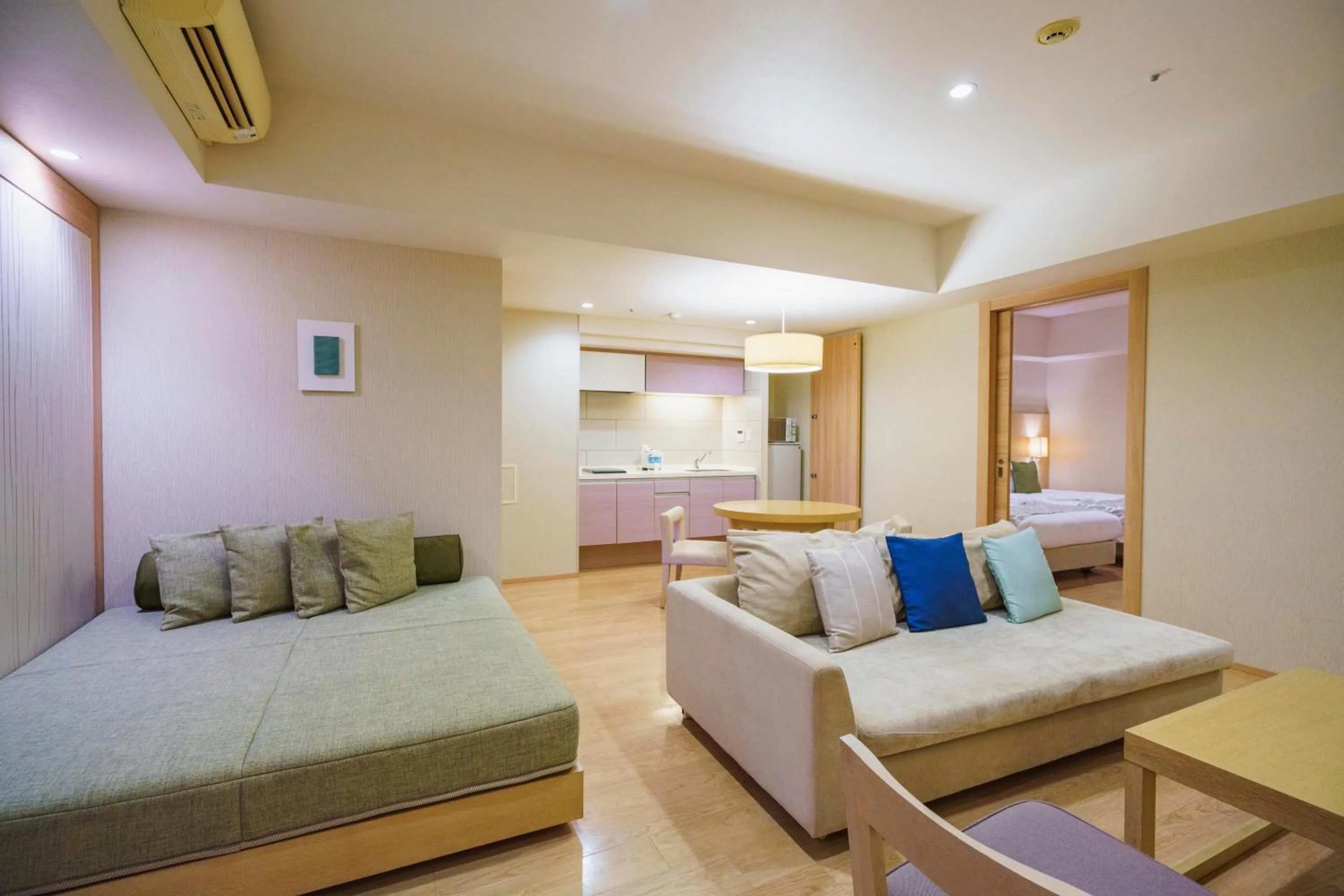Kitchen or kitchenette, Bed in Moon Ocean Ginowan Hotel & Residence