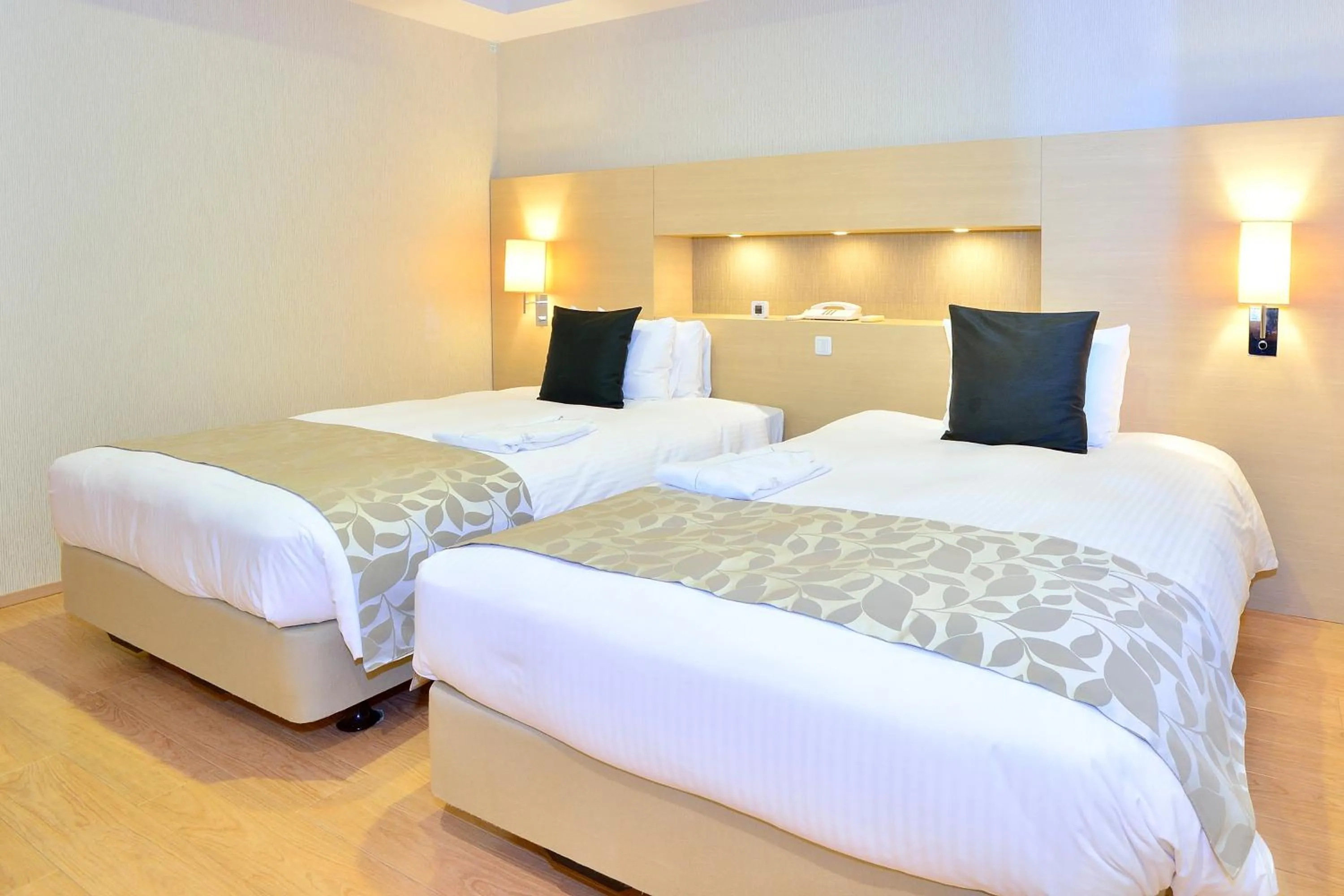 Bed in Moon Ocean Ginowan Hotel & Residence