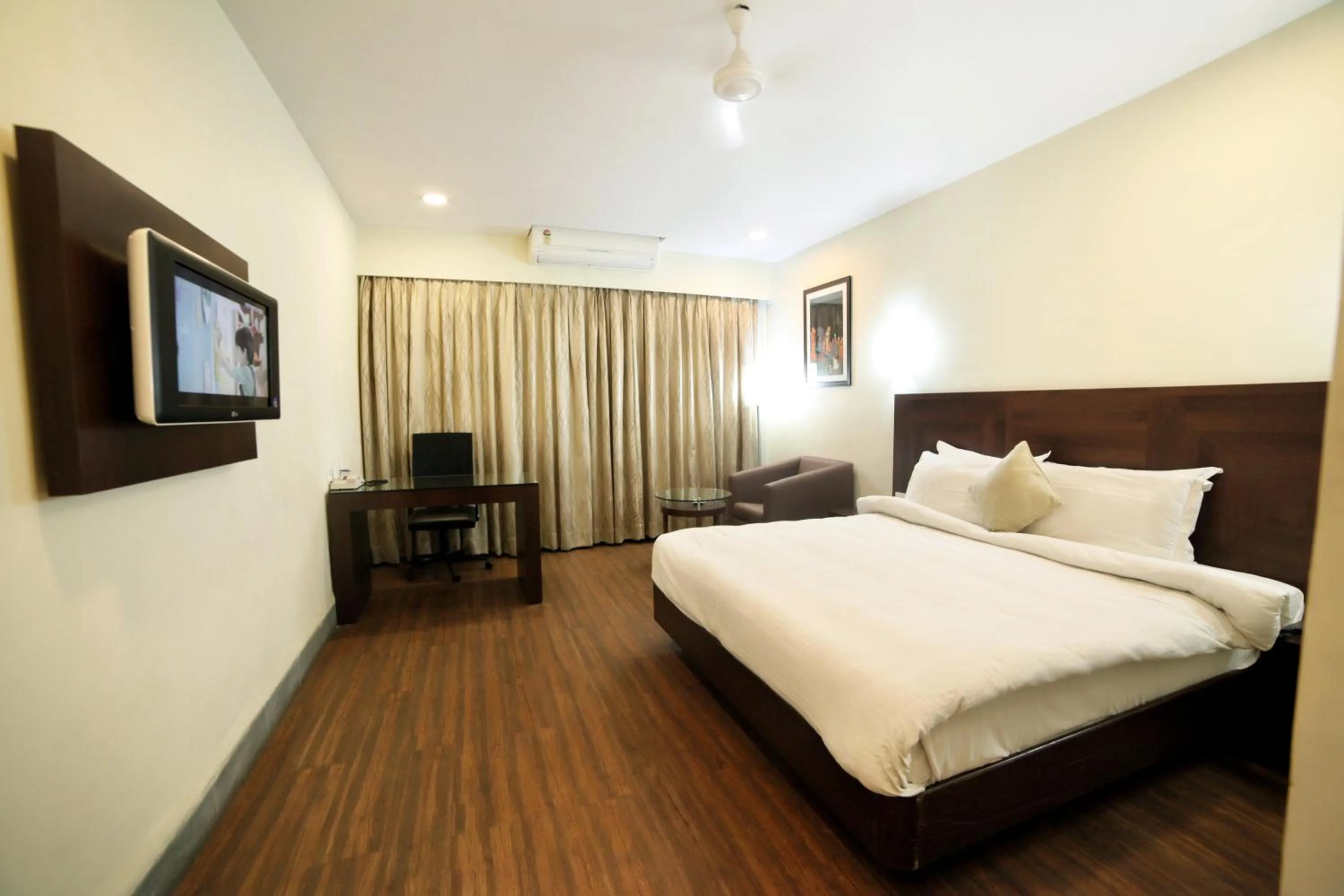 Photo of the whole room, Bed in Chryso Hotels Pvt Ltd