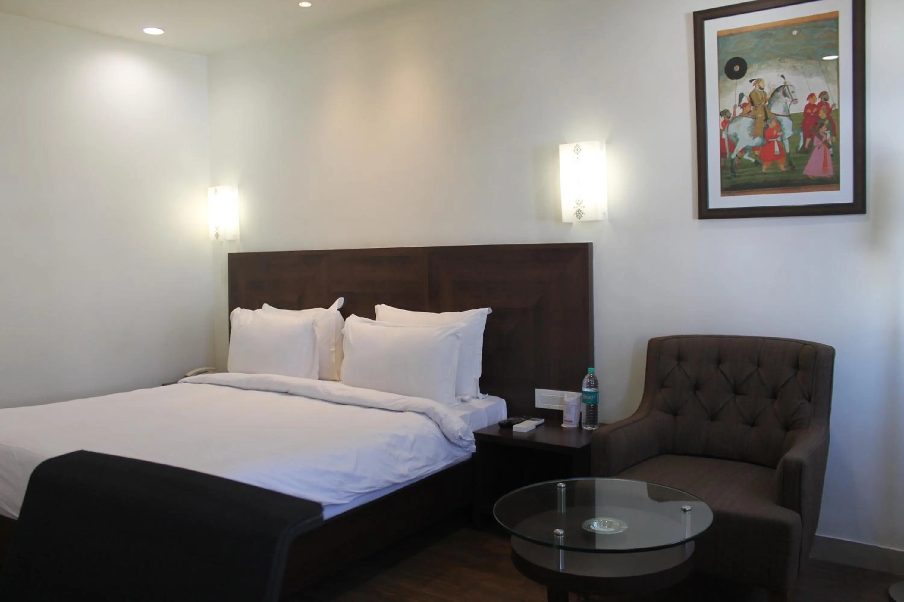 Bed in Chryso Hotels Pvt Ltd