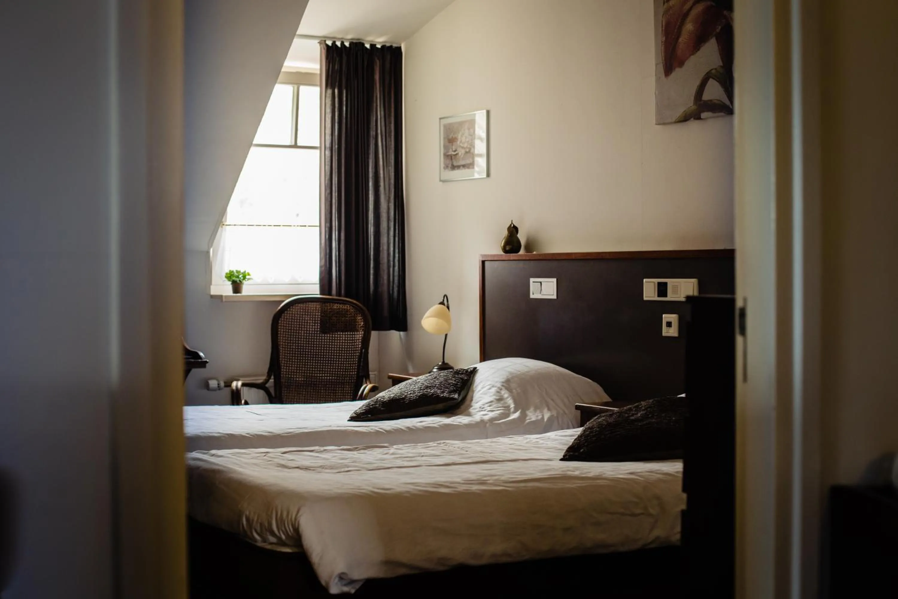 Bed in Hotel de Reiziger