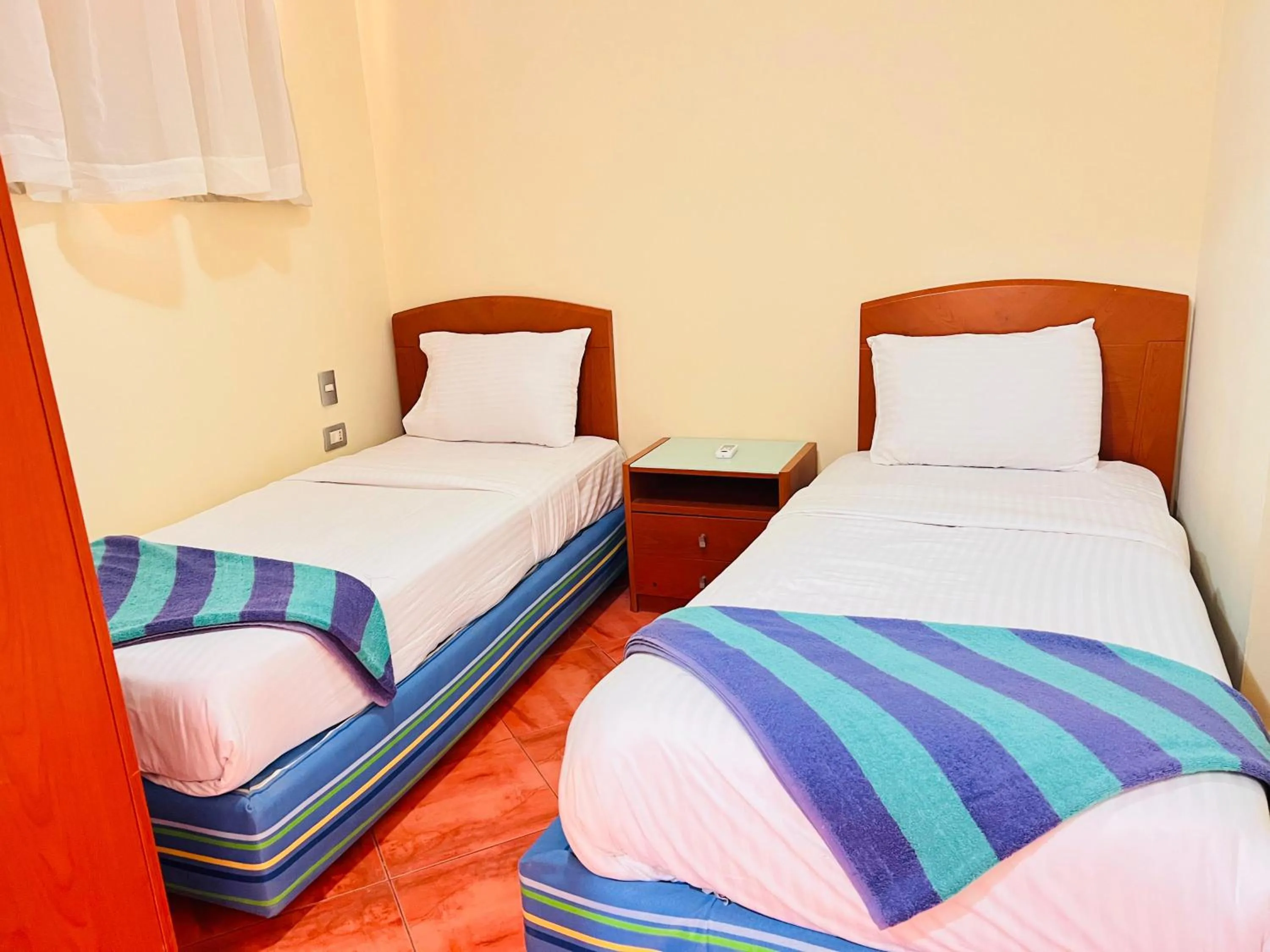 Bed in Porto Marina Apartments powered By Amer-Group