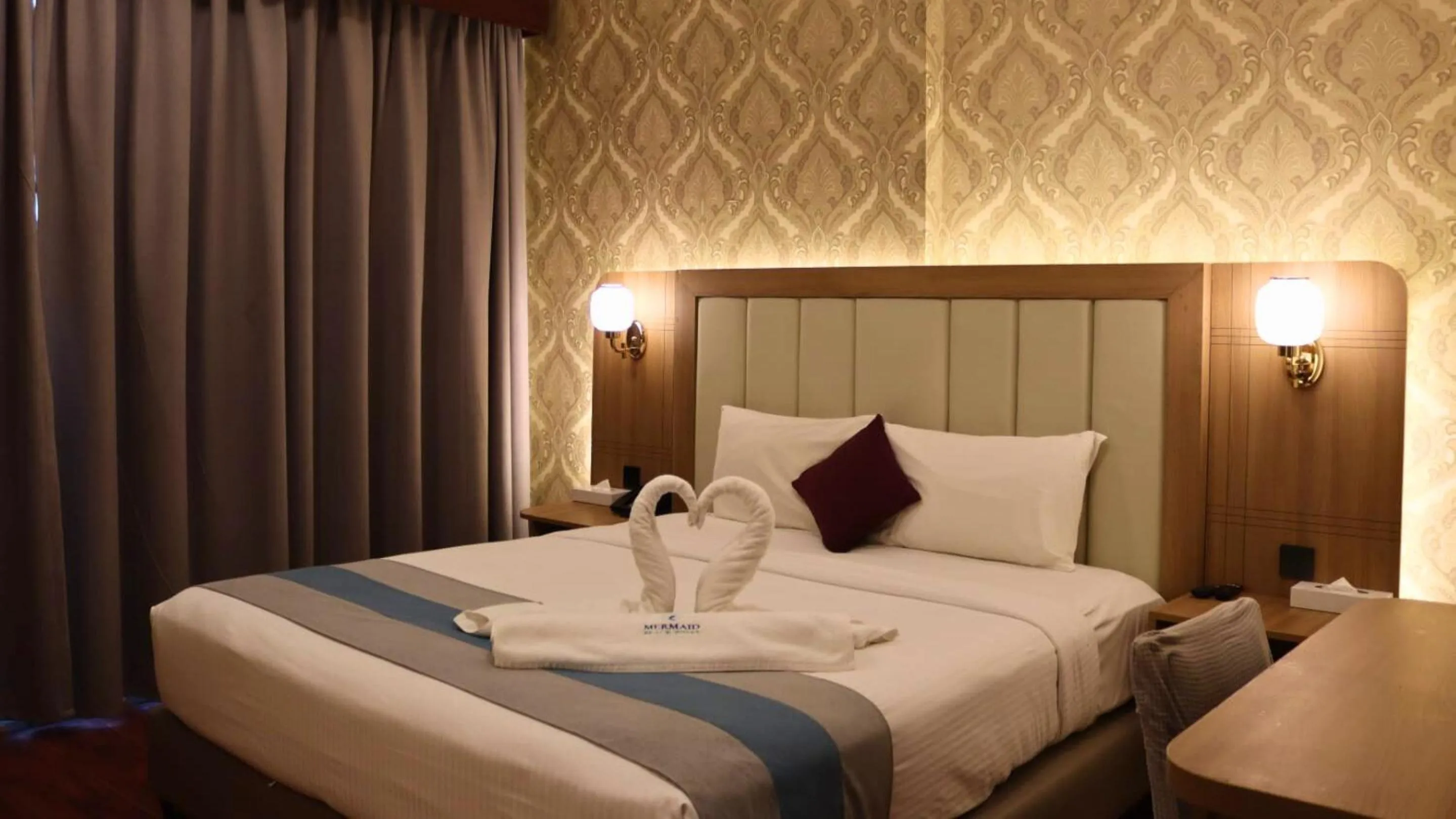 Bed in Mermaid Beach Hotel LLC