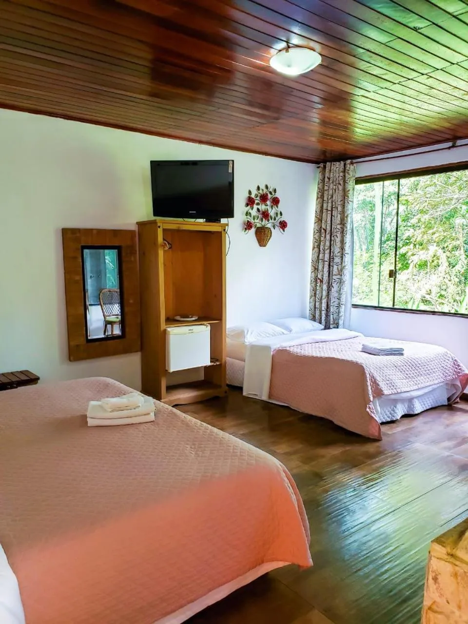 Bed in Pousada Mirante do Penedo