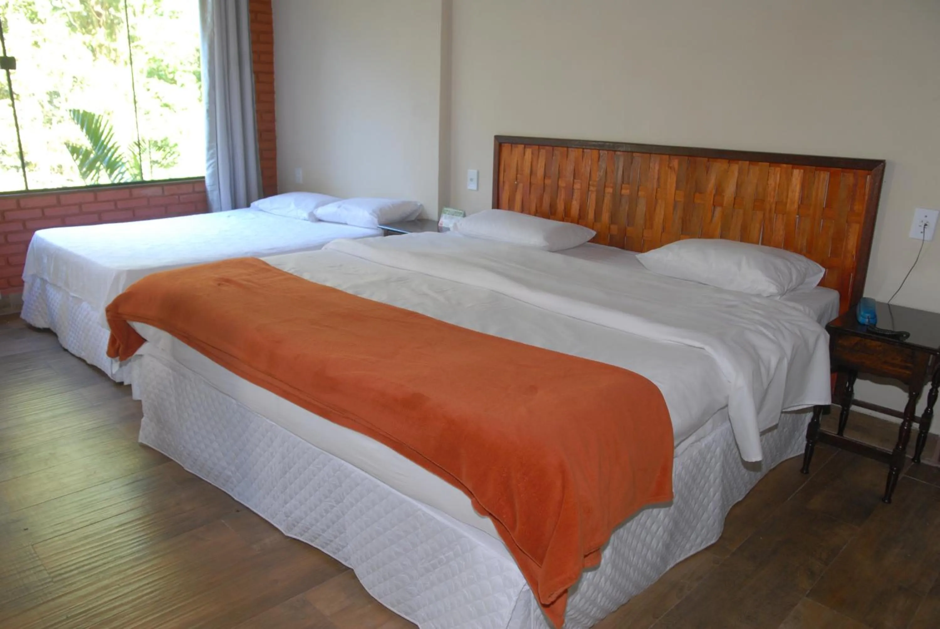 Bed in Pousada Mirante do Penedo