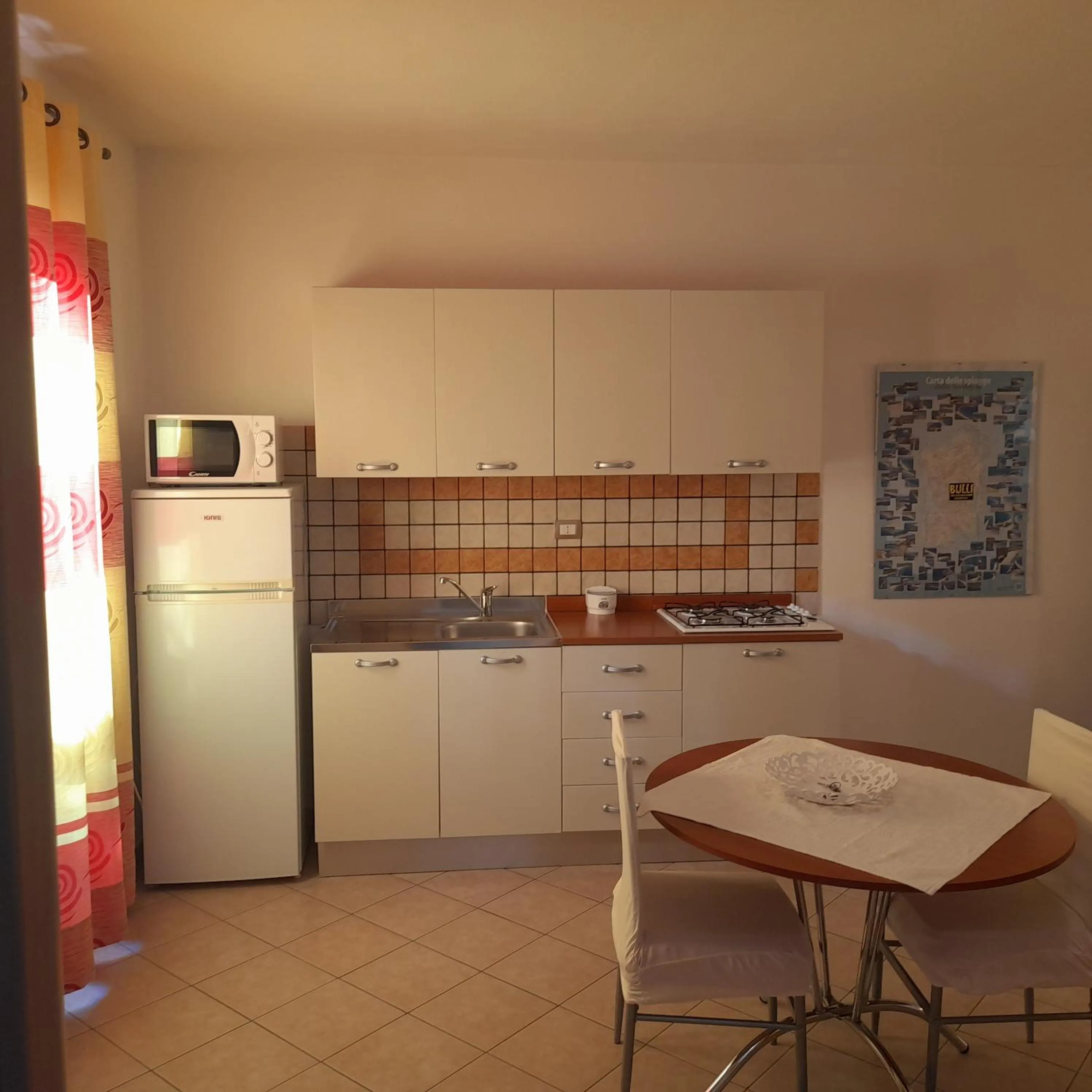 Kitchen or kitchenette in La Fortezza casa vacanze & appartament