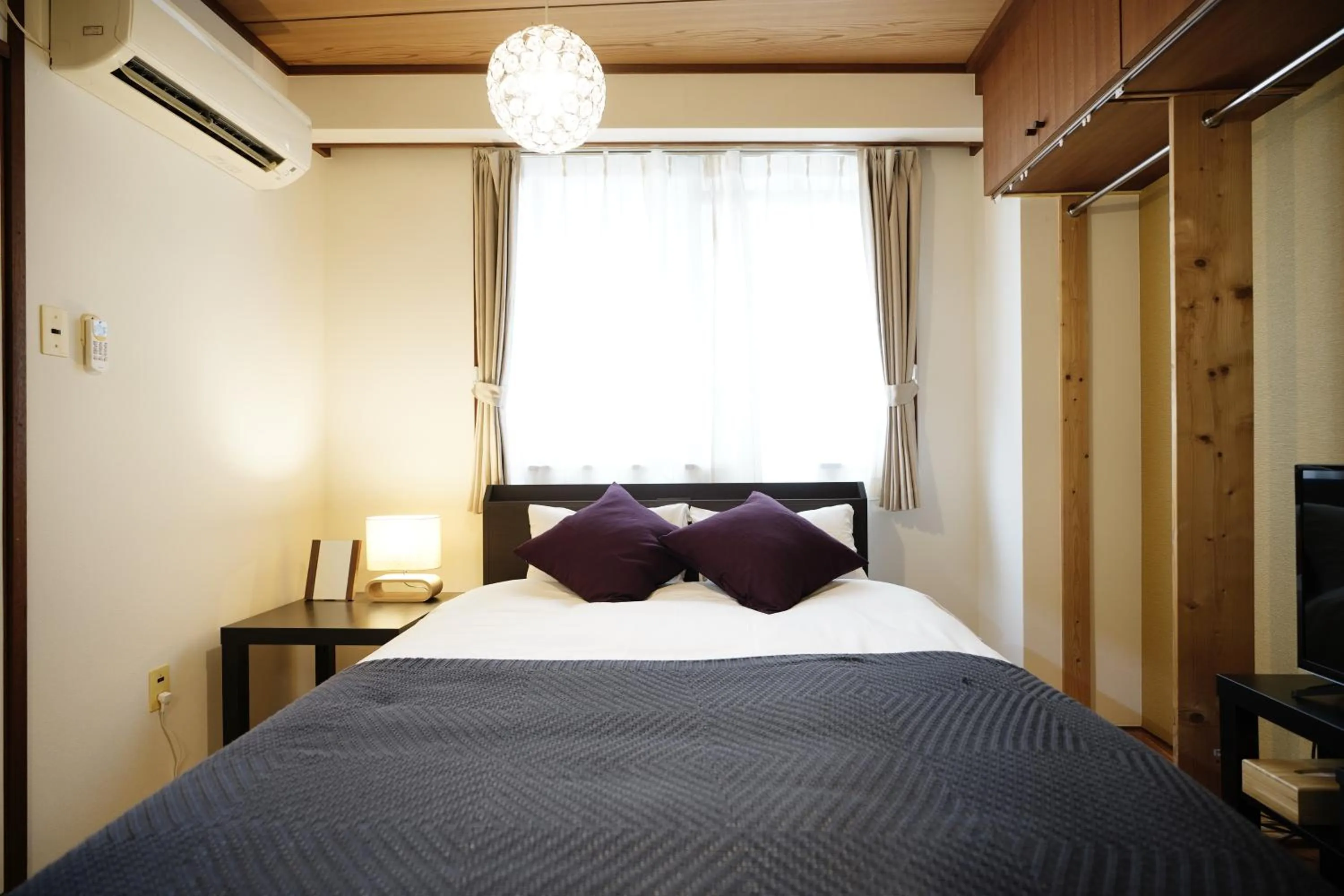 Bedroom, Bed in Naha Southerlies Condominium Kumoji