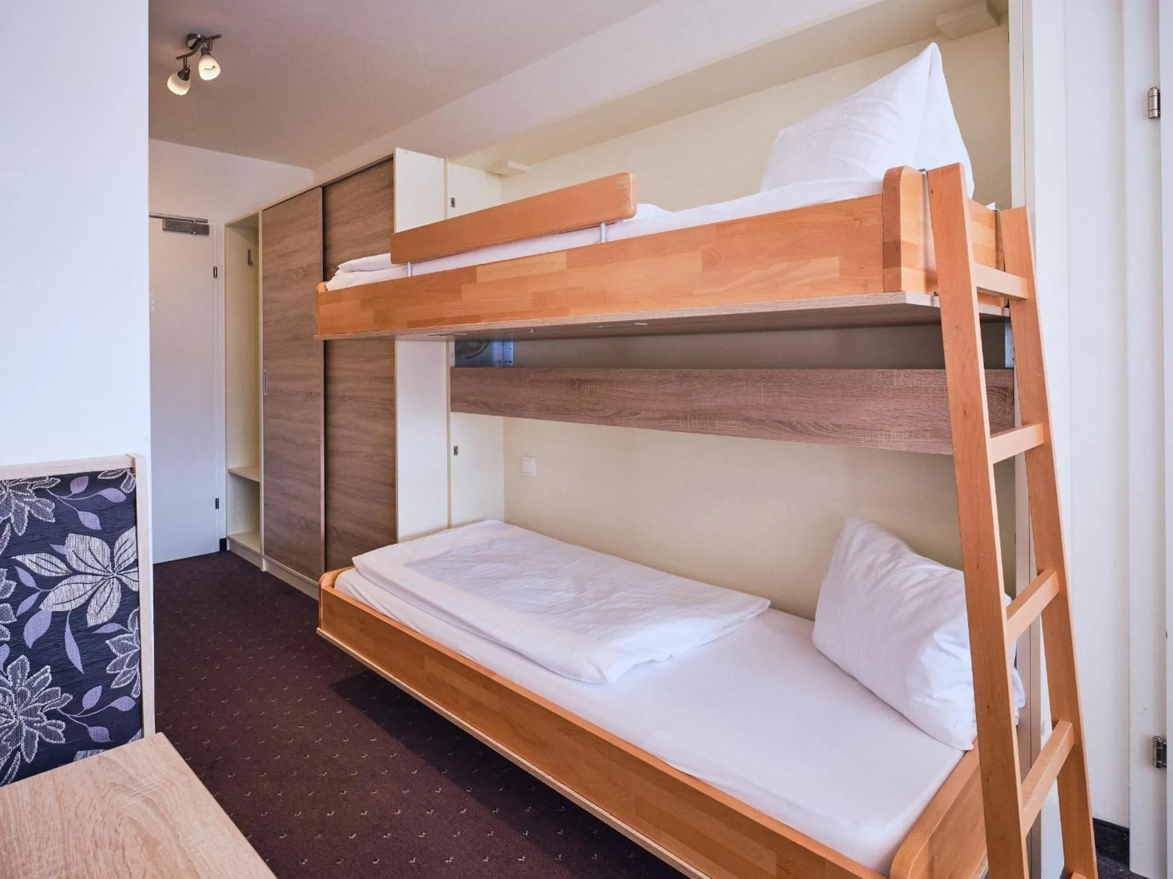 Photo of the whole room, Bed in Hotel Planai by Alpeffect Hotels