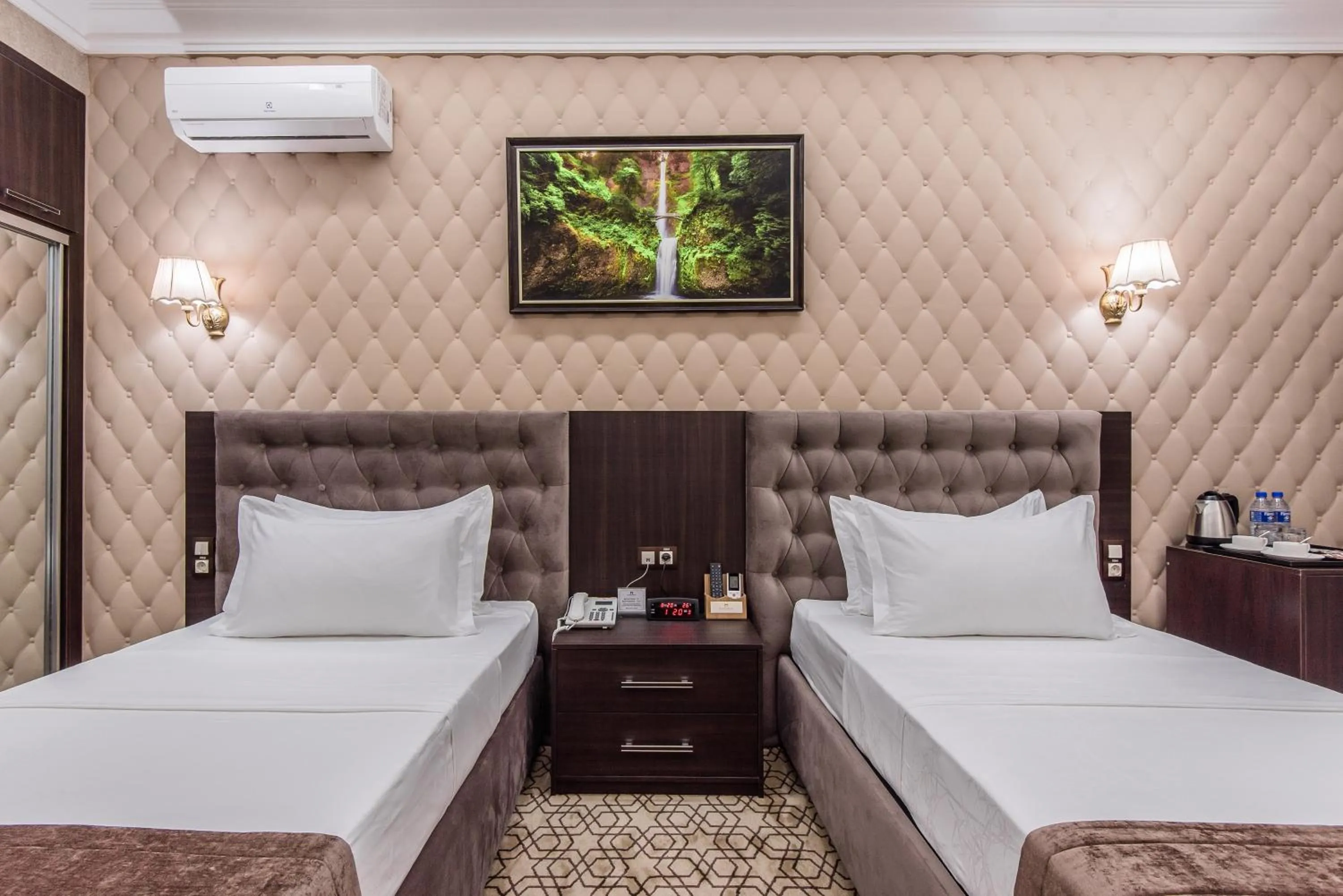 Bed in The Royal Mezbon Hotel & SPA