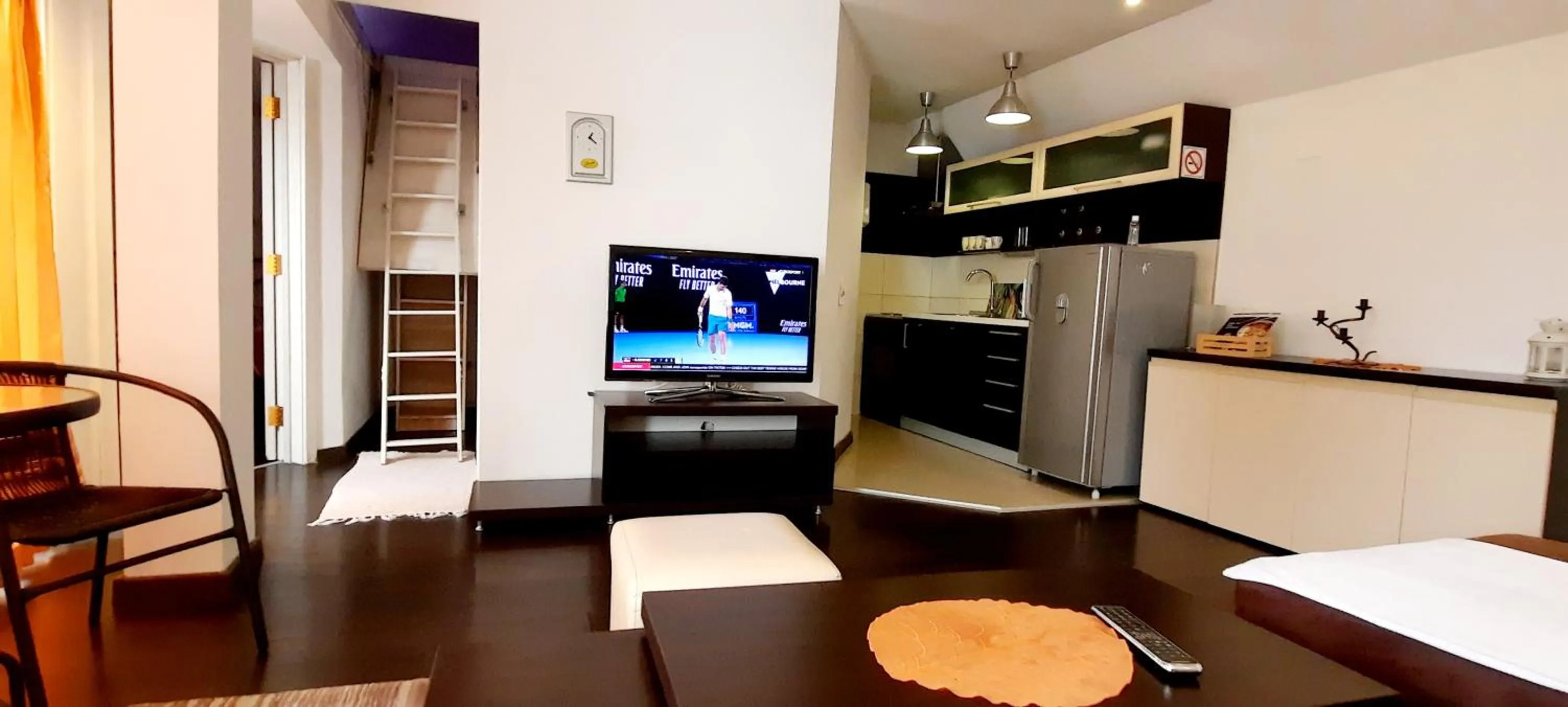 Seating area in Aloha Apartments with pool