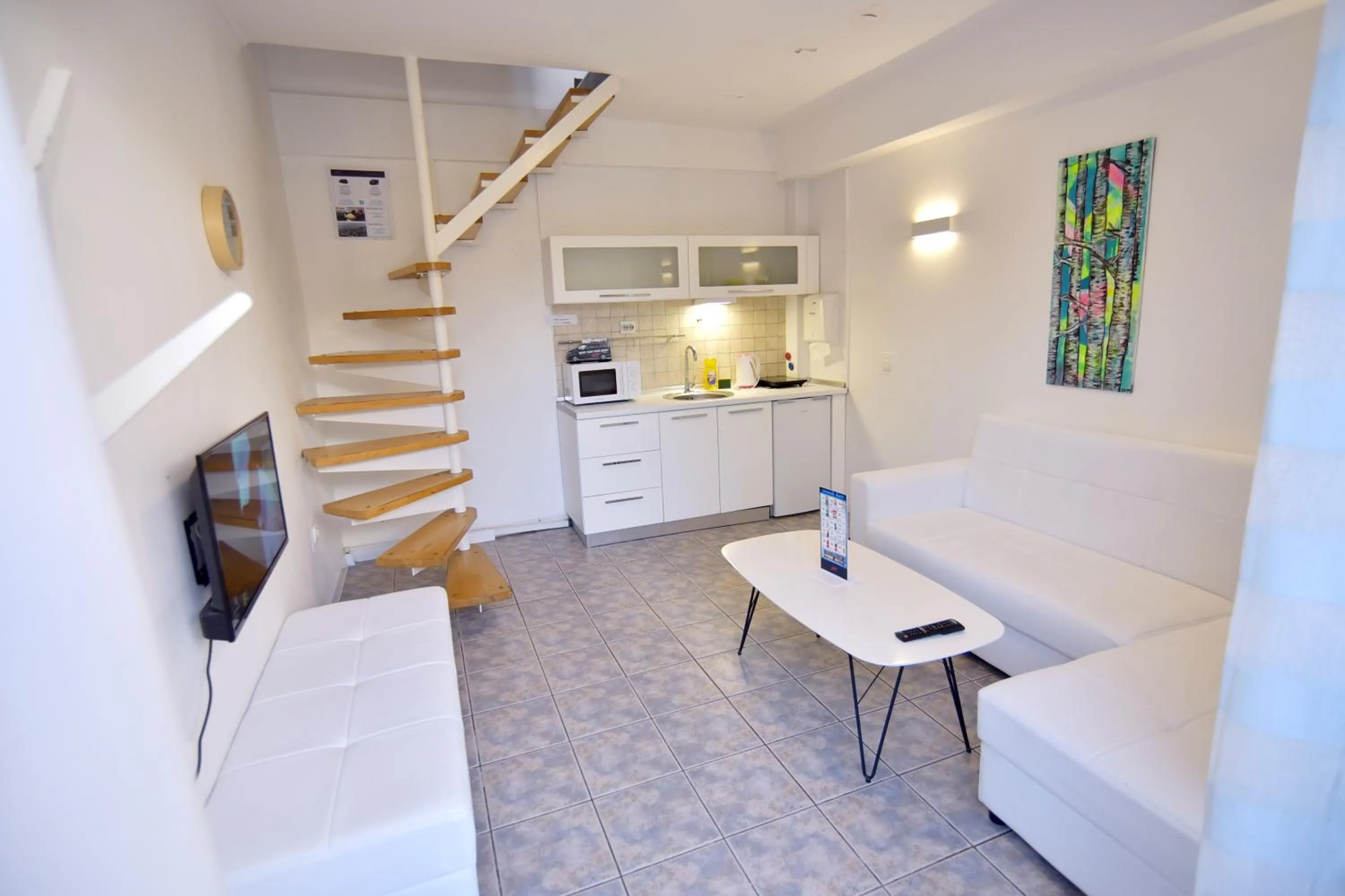 Living room in Aloha Apartments with pool